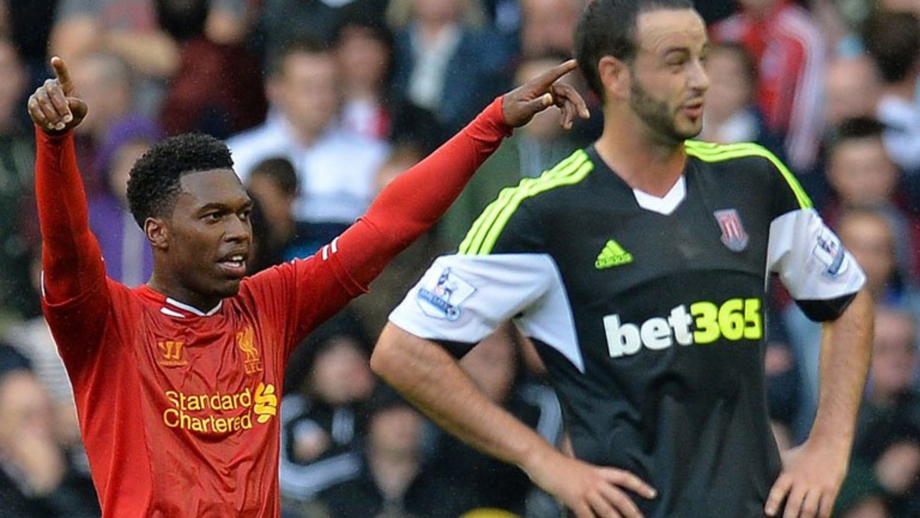 Daniel Sturridge (left) celebrates scoring the first Premier League goal of the season at Anfield on Saturday. Sturridge had the honour of scoring the first goal of the new Premier League season on Saturday when he put Liverpool ahead against Stoke City.