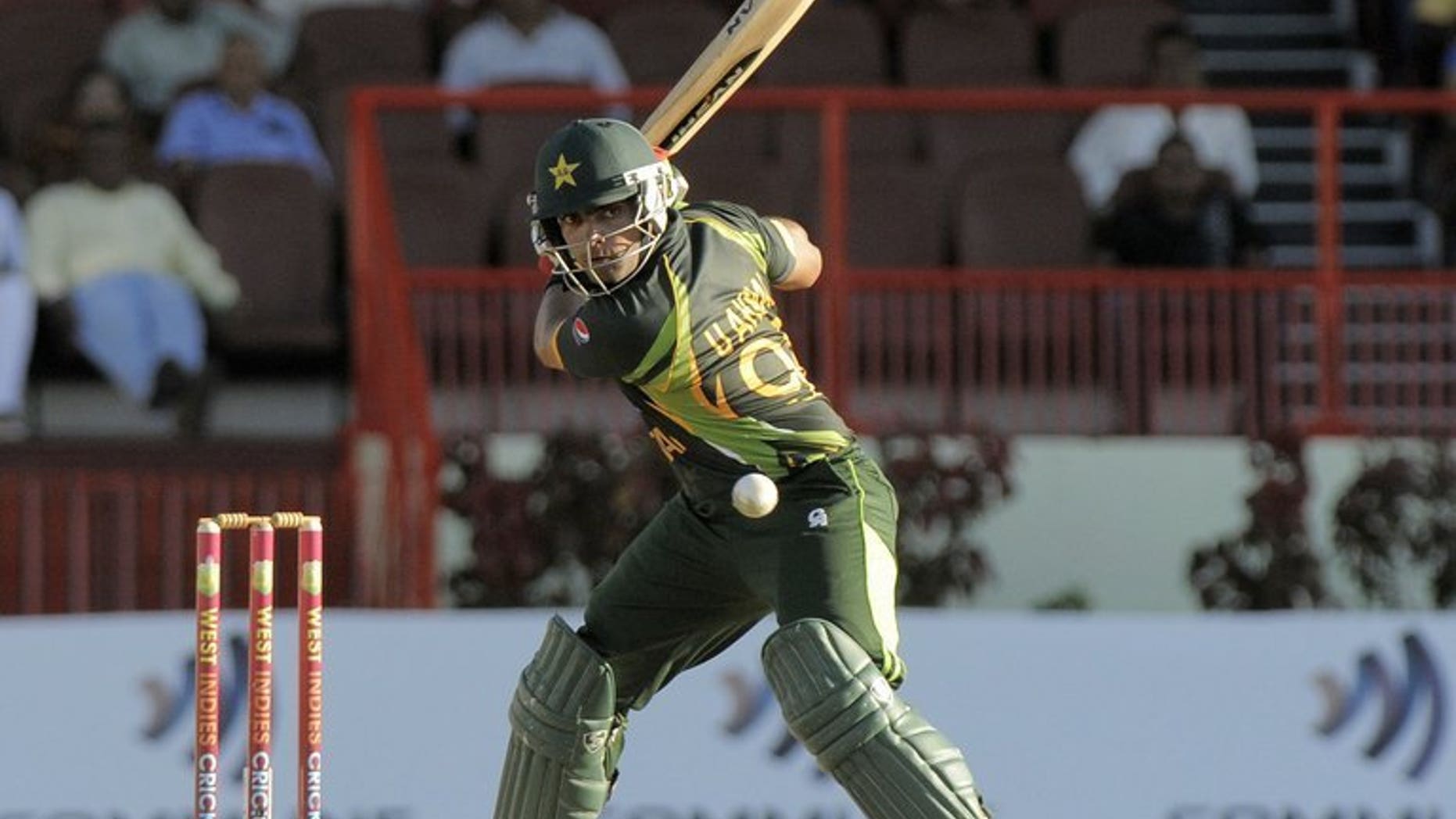 Umar Akmal on his way to 50 against West Indies in Georgetown on July 16. Pakistan's fast-rising batsman Umar Akmal suffered a seizure during a flight to Jamaica and spent a night in a hospital before being rushed home, a relative said Sunday.