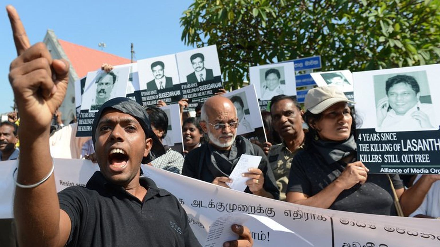 Sri Lankan journalists and media activists demonstrate, demanding investigations into over a dozen killings of editors, reporters and newspaper workers in recent years, in the capital Colombo on January 29, 2013. A Sri Lankan media rights group on Sunday accused the military of intimidating journalists who reported a deadly army crackdown on villagers protesting at contaminated water supplies.