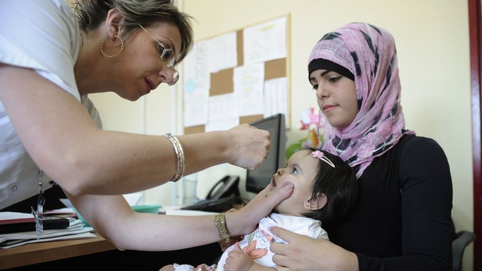 A Bedouin child receives a vaccine against polio at a clinic in Rahat on August 5, 2013. Israel took its polio vaccination campaign nationwide on Sunday, saying a two-week vaccination effort in the south was not enough to curb the threat of an outbreak of the virus.
