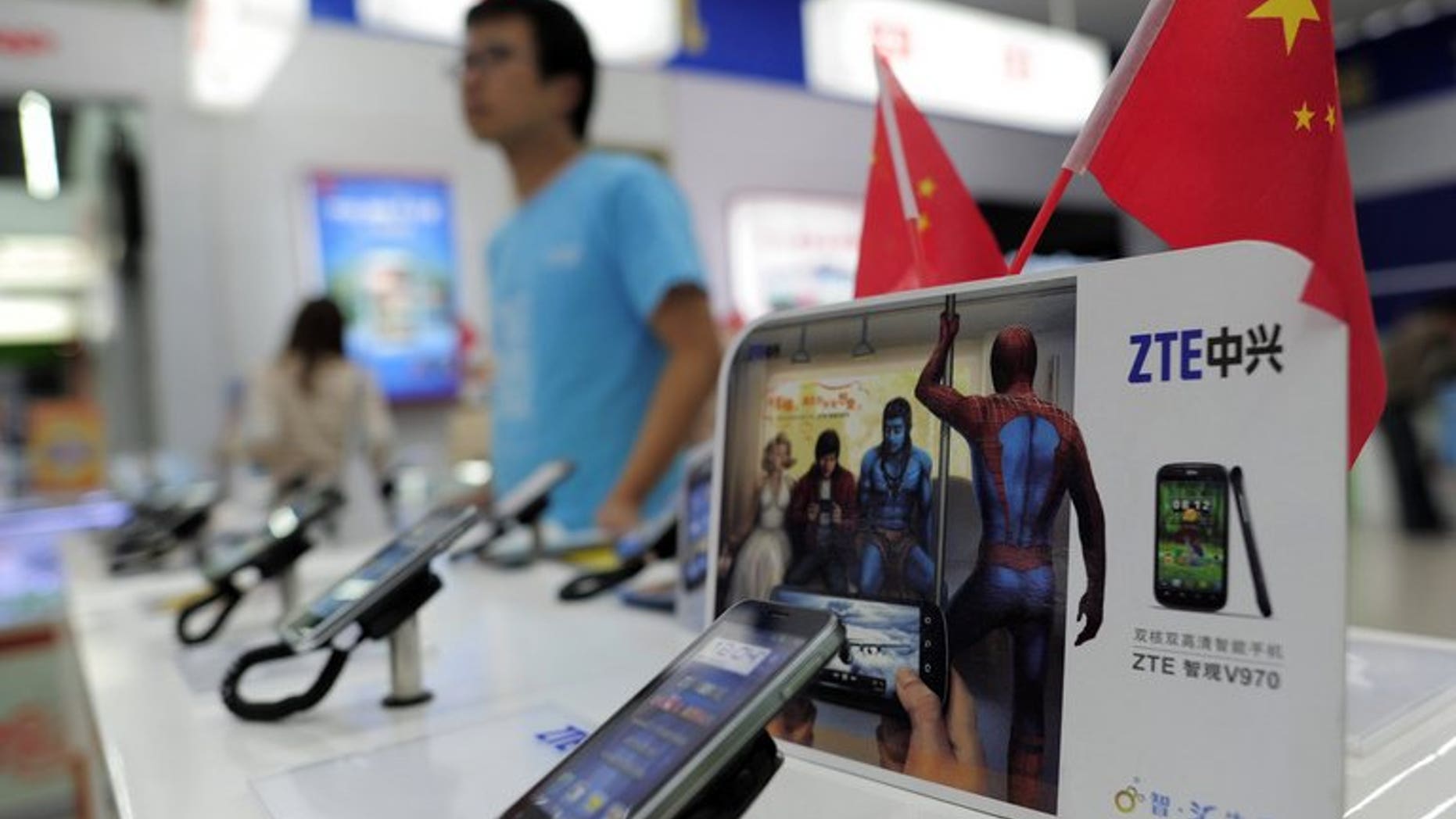 Mobile devices are displayed on a ZTE sales counter in Wuhan, central China's Hubei province on October 8, 2012. Ethiopia signed an $800-million (600-million-euro) agreement with Chinese telecom giant ZTE Sunday to expand its telecommunications network, national operator Ethio Telecom said.
