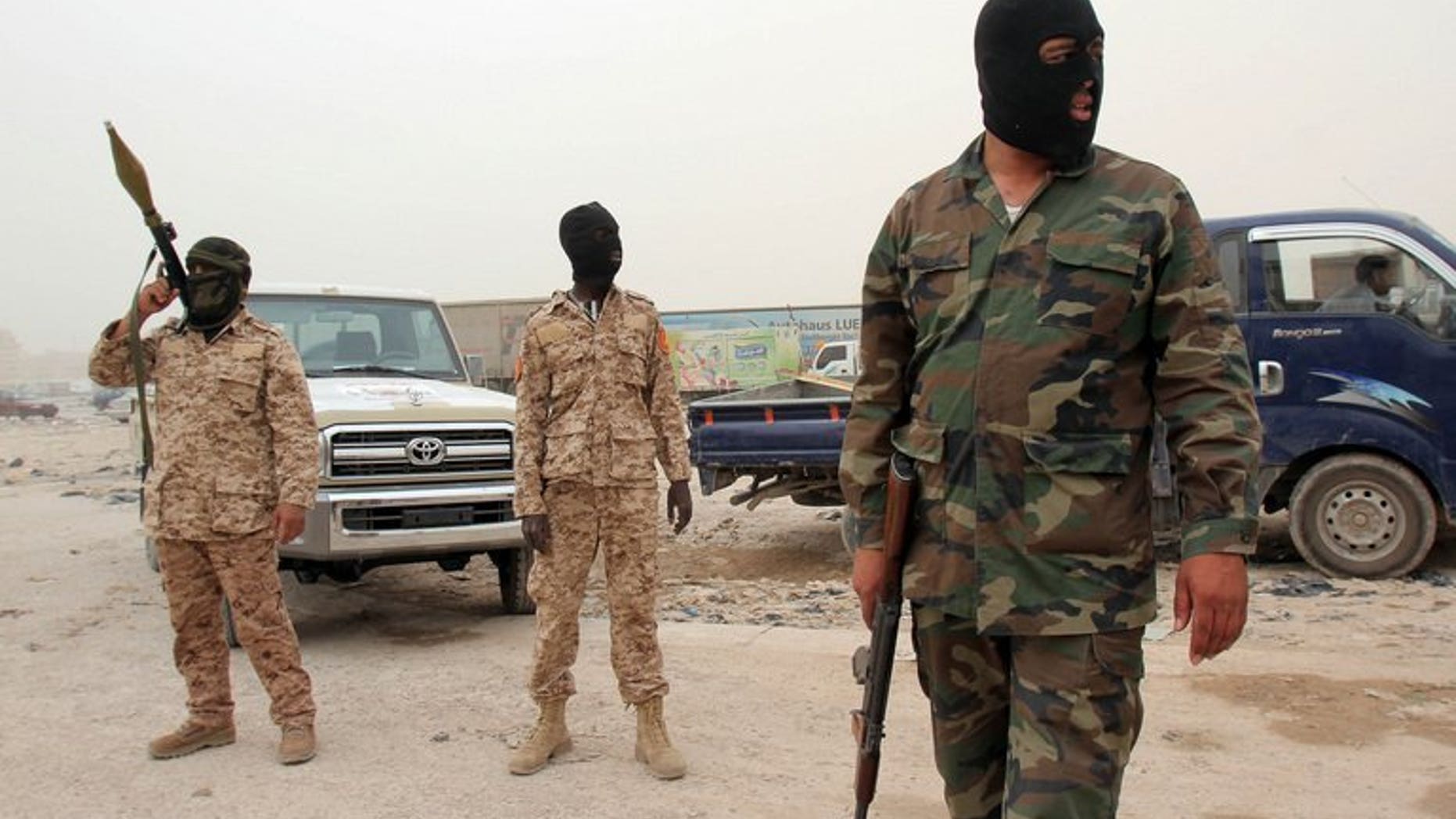 Members of the Libyan Rapid intervention force patrol at a checkpoint in Benghazi on May 16, 2013. A former judge, aged 79, was gunned down as he left a mosque in the restive eastern city of Benghazi, a Libyan security services spokesman said.