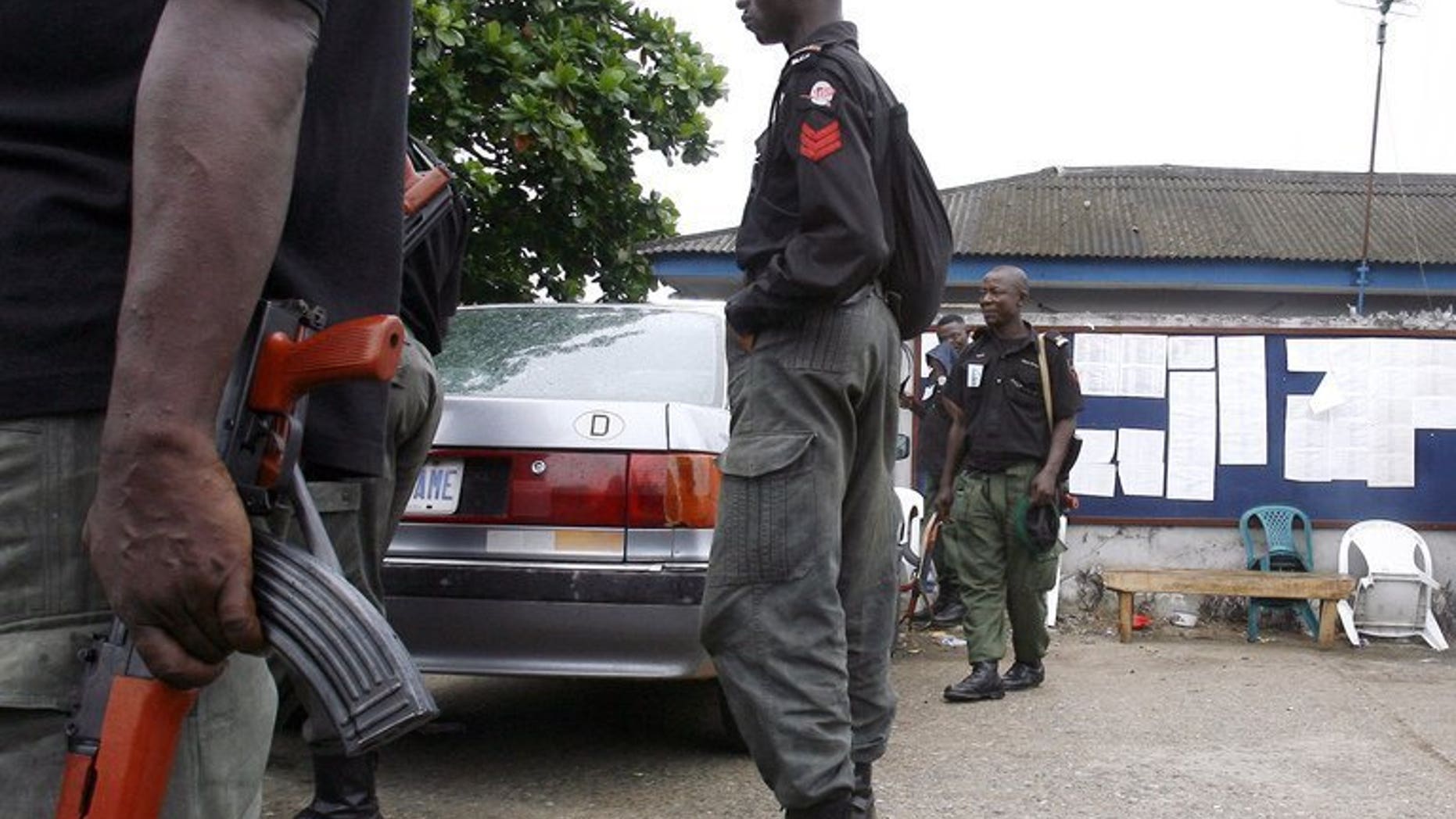 Nigerian policemen patrol in Lagos on April 22, 2007. Nigerian police have arrested two fake doctors accused of causing the deaths of "many" women during childbirth or surgery at a clinic they ran for three years.