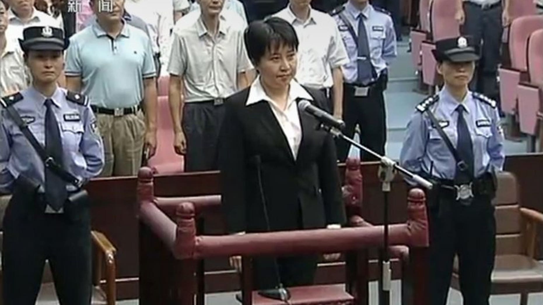 Gu Kailai, the wife of disgraced Chinese politician Bo Xilai, in court during her murder sentencing on August 20, 2012. Relatives of Neil Heywood, the British businessman Gu was convicted of murdering, are close to agreeing compensation with her representatives, a lawyer said Monday.
