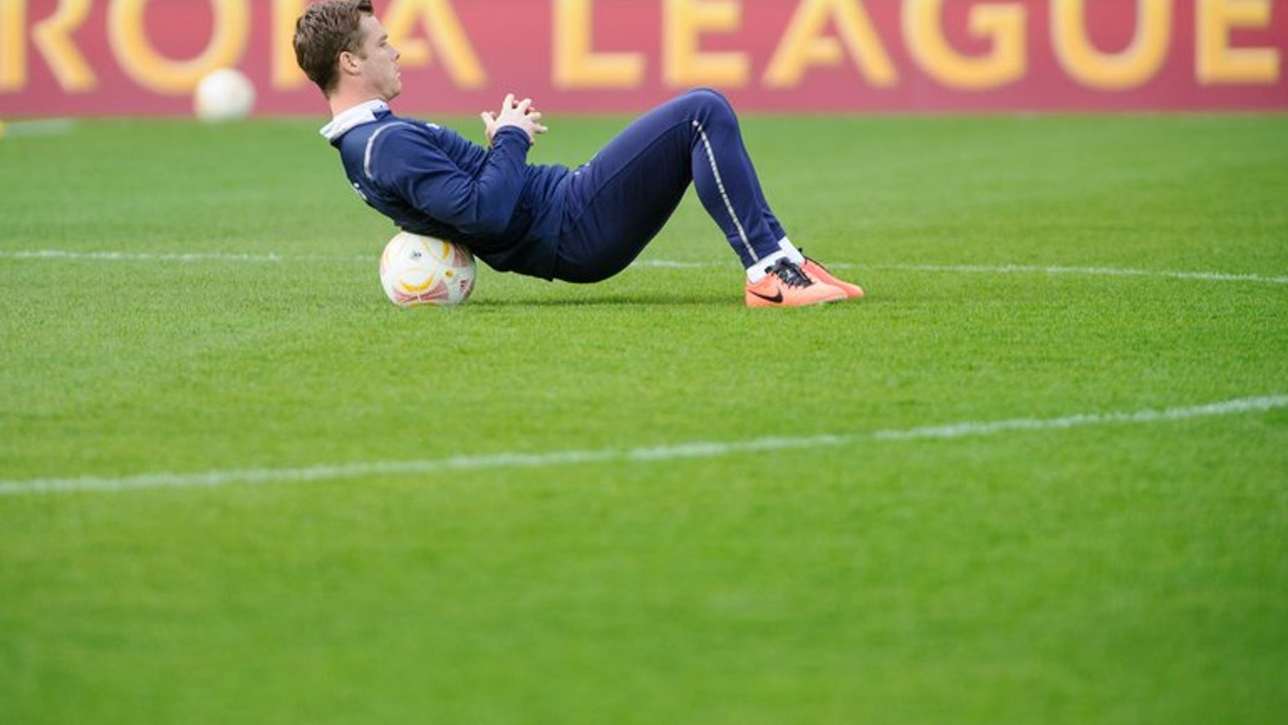 Scott Parker stretches during a training session at the Saint Jakok stadium in Basel on April 10, 2013. Fulham signed England midfielder Parker from Tottenham for an undisclosed fee on Monday.