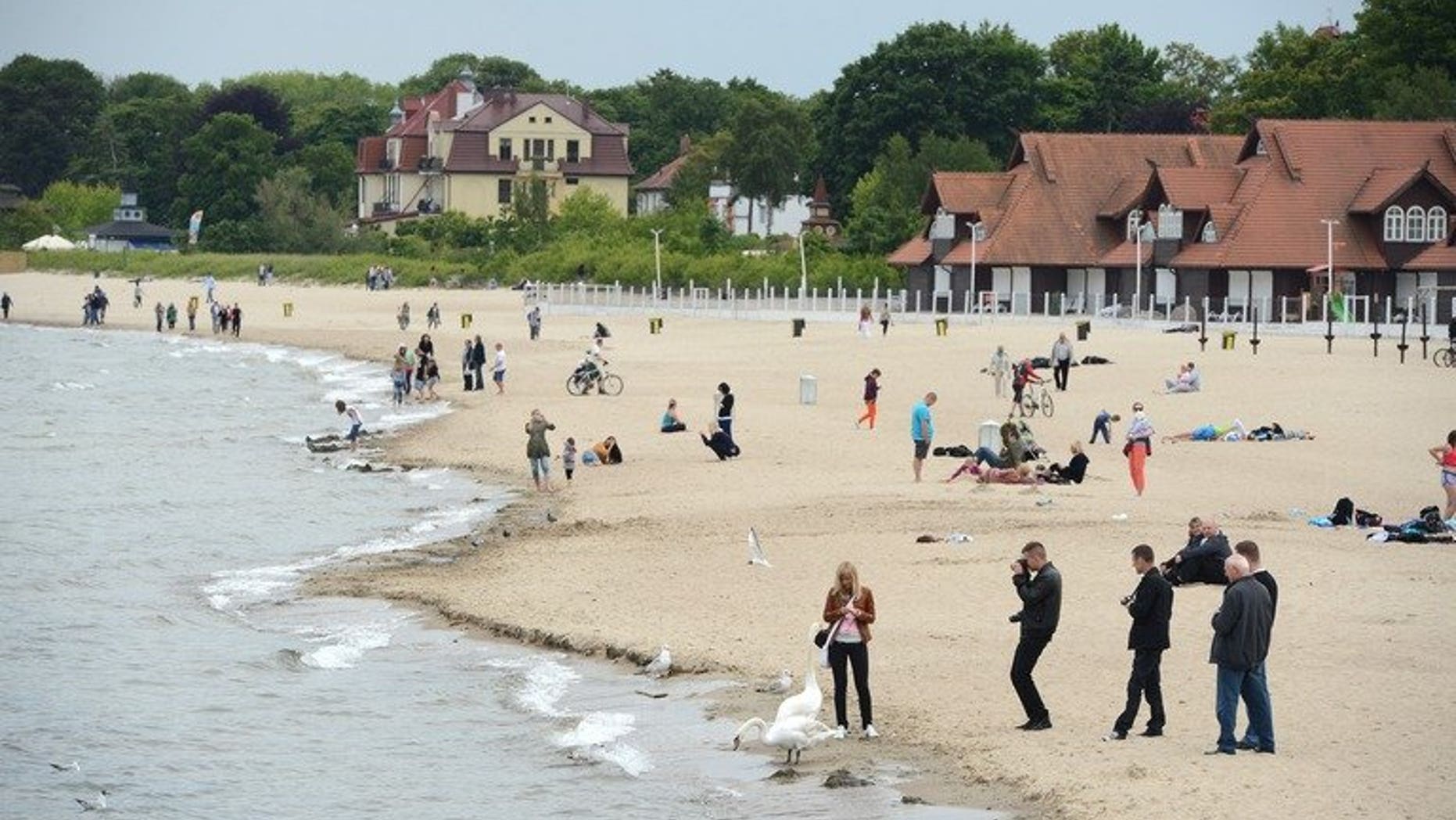 People relax on the beach on the Baltic Sea on June 7, 2012 in Sopot neer Gdansk. Mexico voiced concerns to Poland on Monday after a video surfaced of an alleged group of soccer hooligans mobbing Mexican navy cadets resting on a Polish beach.