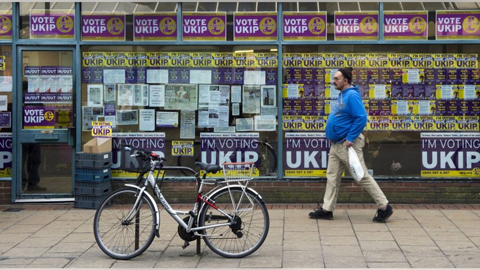 This file photo shows a man walking past the British UK Independence Party (UKIP) office in Eastleigh, southern England, on February 25, 2013. The chief executive of UKIP has resigned by "mutual agreement" after less than a year in the job, the party confirmed on Monday.