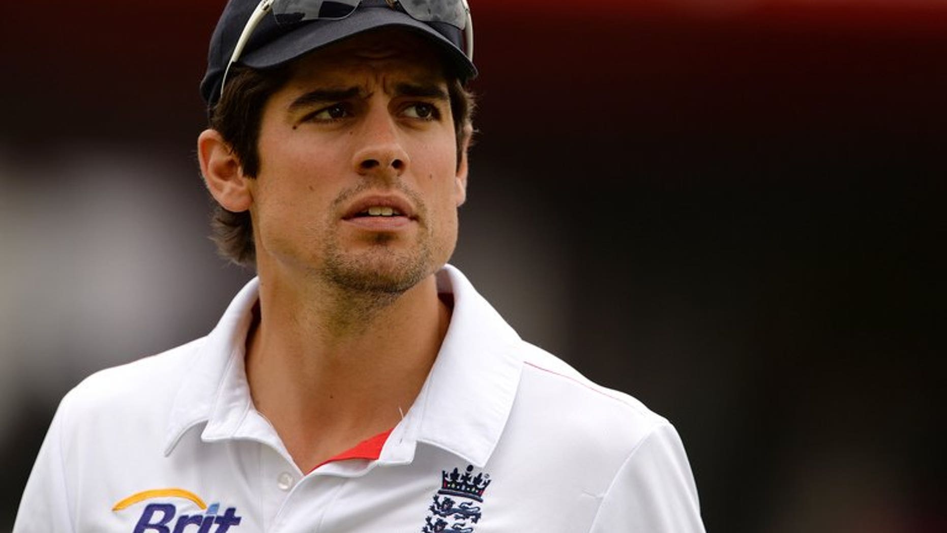 England's Alastair Cook leaves the field for the lunch break during the third Ashes Test match against Australia at Old Trafford in Manchester on August 4, 2013. Cook said he is happy to face continued criticism over his leadership style so long as his side keep winning.