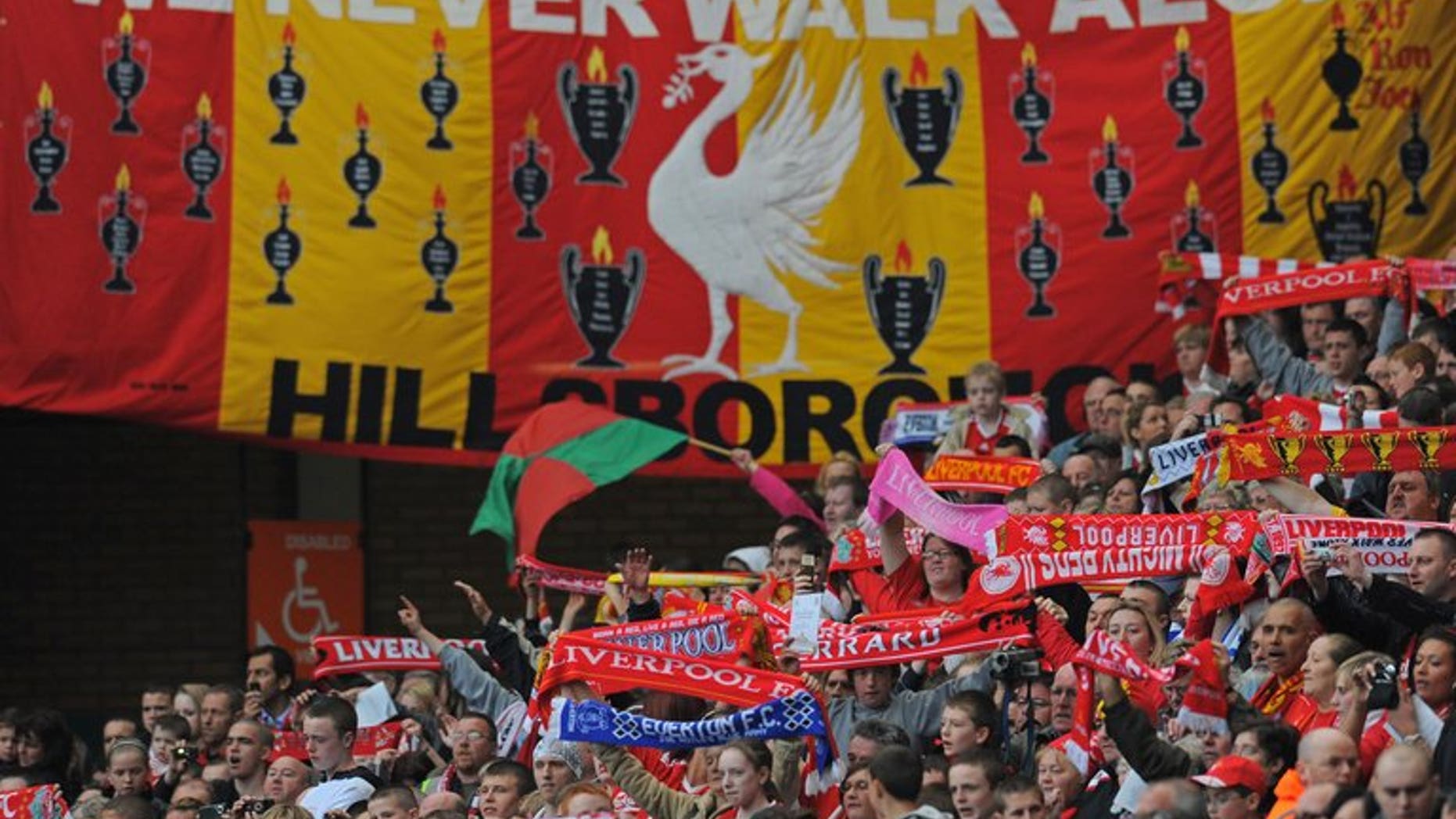 Liverpool supporters attend a Hillsborough memorial service 20 years after the disaster, at Anfield, on April 15, 2009. Police officers investigating the 1989 disaster wanted funds donated in memory of the victims to be spent on holiday flats and gifts for officers, British media reported.