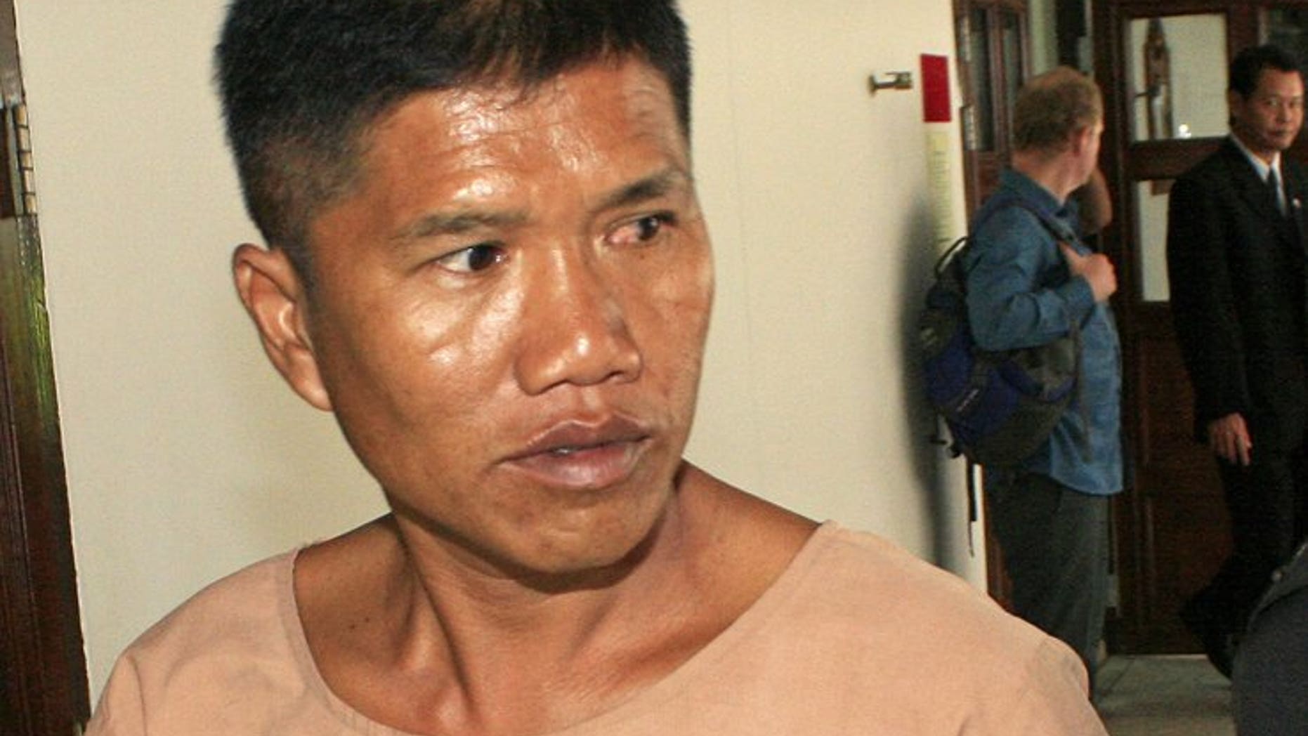 Former policeman Uthai Dechawiwat appears at the Provincial court in Chiang Mai province on August 20, 2013. The court sentenced Dechawiwat to nearly four decades in jail for shooting dead a Canadian tourist in a scuffle in a sleepy northern resort town.