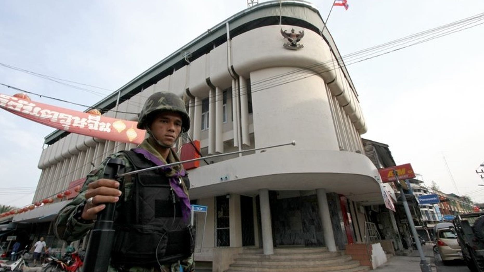 This picture taken on March 2, 2010 shows a Thai soldier using a GT200 detector as he patrols the streets of Yala, in Thailand's restive south. A British businessman who sold fake bomb detectors worldwide was jailed for seven years on Tuesday, with his judge branding the devices "useless".
