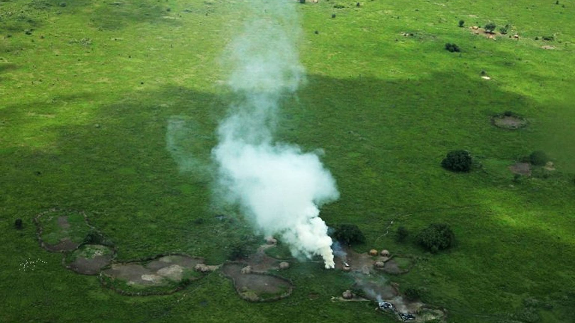 Houses burnt by cattle raiders in a village in Pibor County, in South Sudan's Jonglei state, emit plumes of smoke on July 12, 2013. A top army commander in the troubled new nation of South Sudan has been arrested over a string of alleged human rights violations, officials said Tuesday.