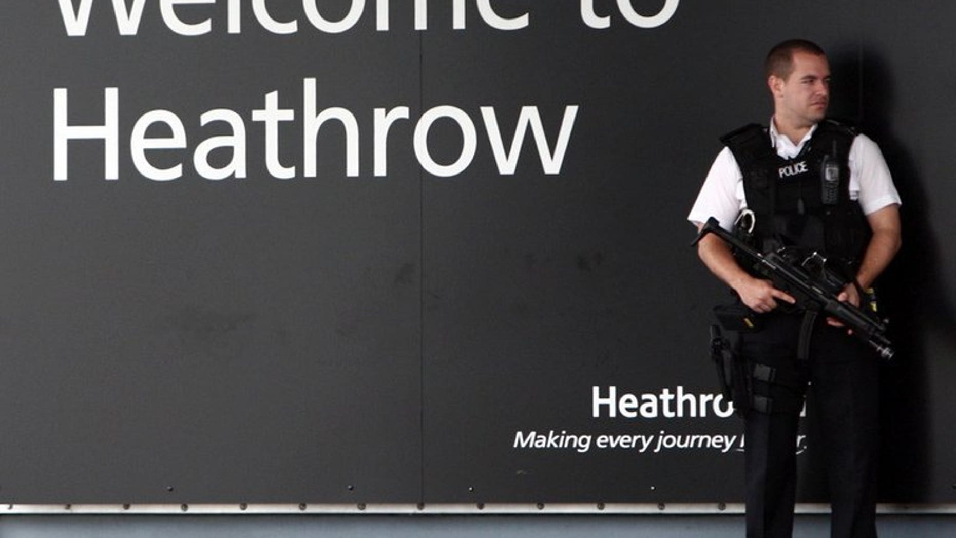 A police officer stands guard at Heathrow airport on June 30, 2011. The law under which British police detained David Miranda, the partner of US journalist Glenn Greenwald, gives broad powers to officials at ports and borders to question those they suspect of terrorism.