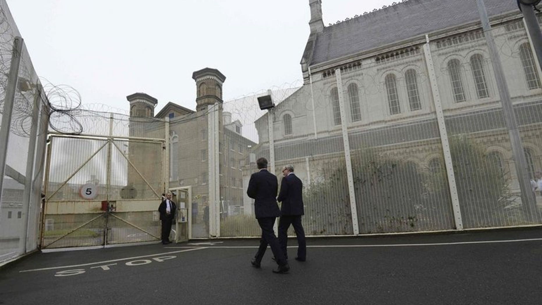 Prime Minister David Cameron visits Wormwood Scrubs Prison in west London last October. A triple murderer is appealing to the European Court of Human Rights to challenge his "life means life" sentence, the first Briton to do so.