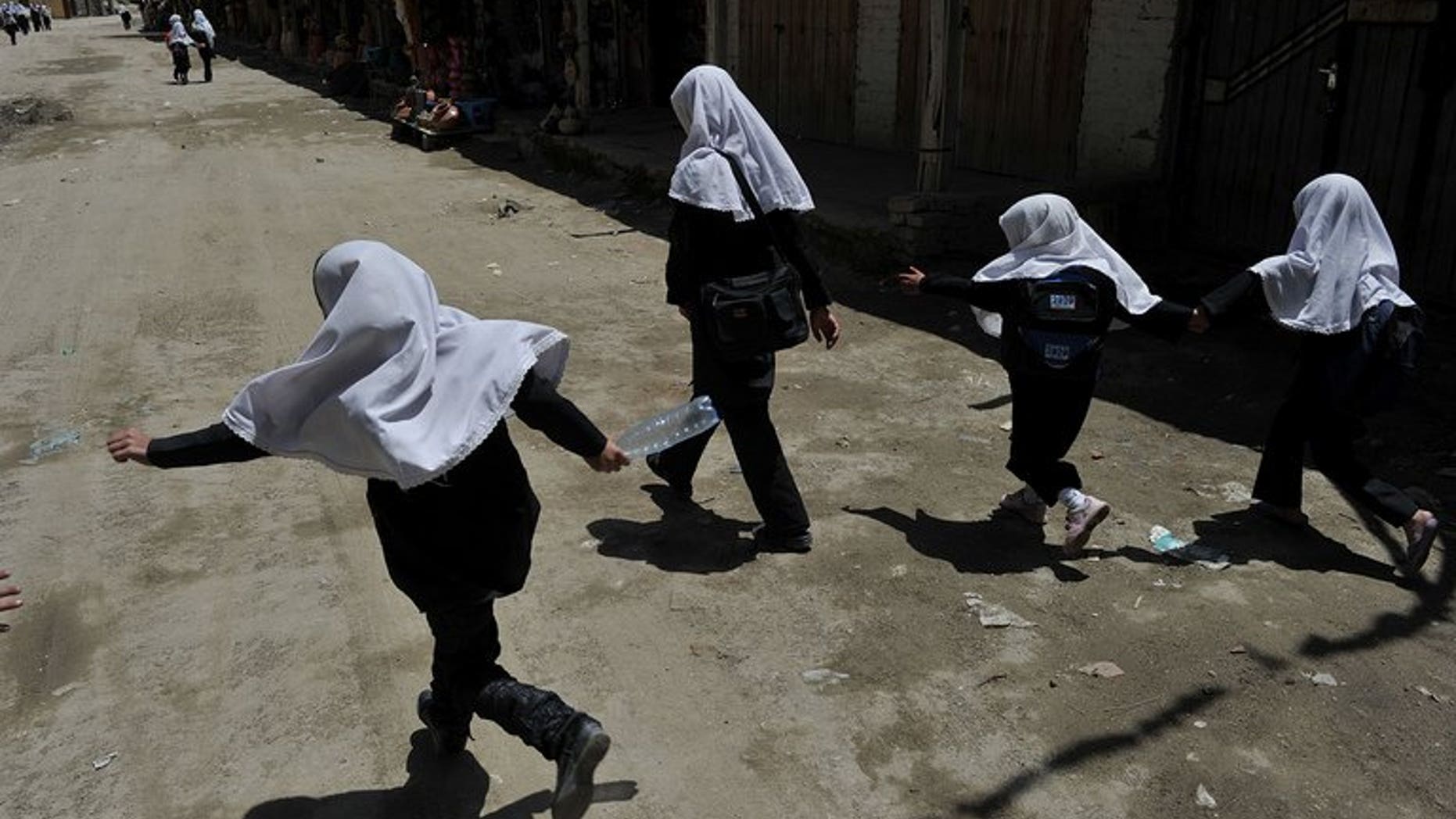 Afghan schoolgirls in Istalif, north of Kabul, on May 29, 2012. The education chief of an Indonesian city sparked outrage Wednesday after proposing that teenage schoolgirls should undergo virginity tests to enter senior high school.