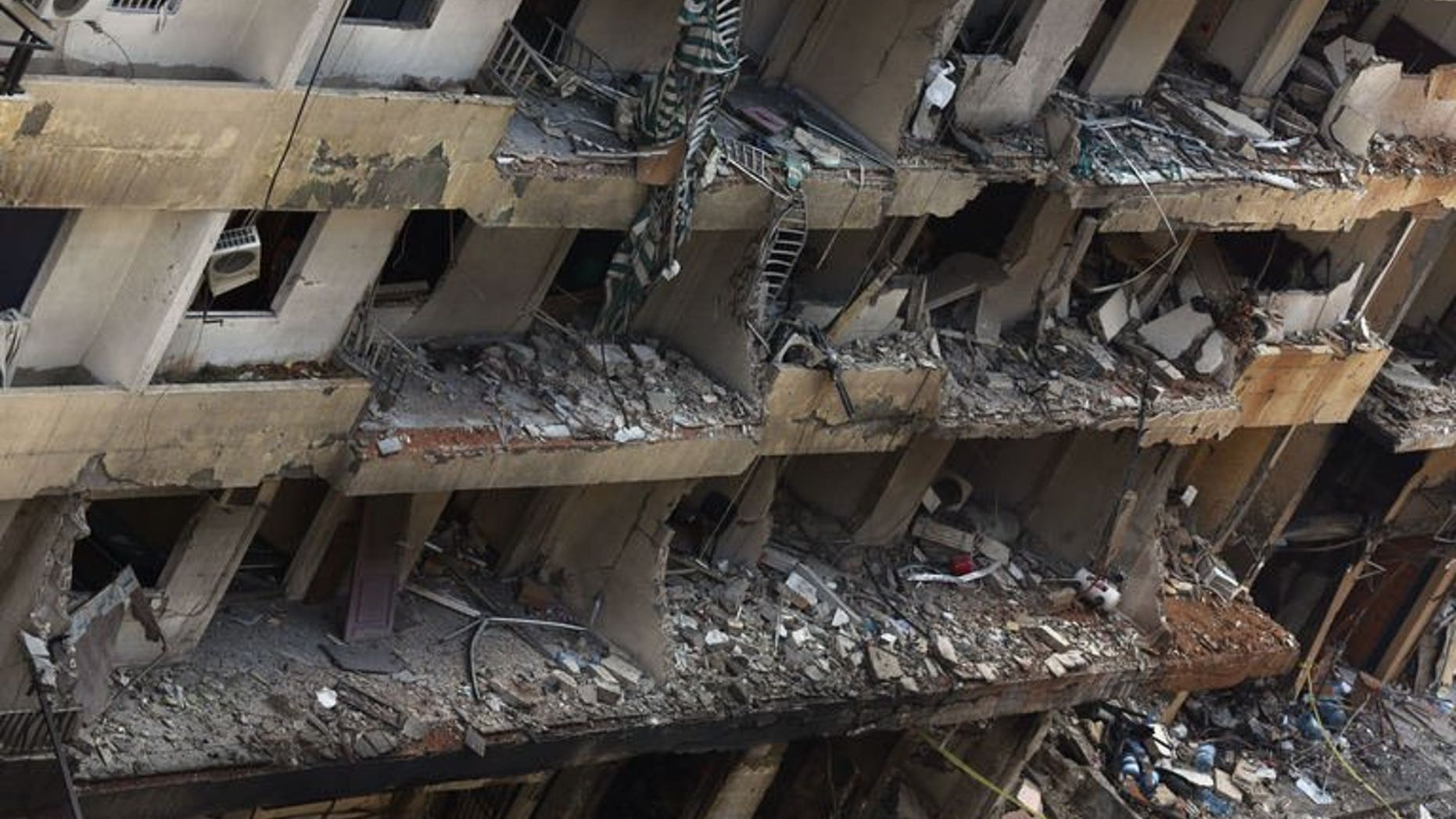 Destruction on August 16, 2013, following a deadly car bomb attack the previous day in Beirut. The Lebanese army is fighting a "total war" against terrorism whose aim is "to provoke sectarian strife" in the small Mediterranean country, army chief General Jean Kahwaji said Wednesday.