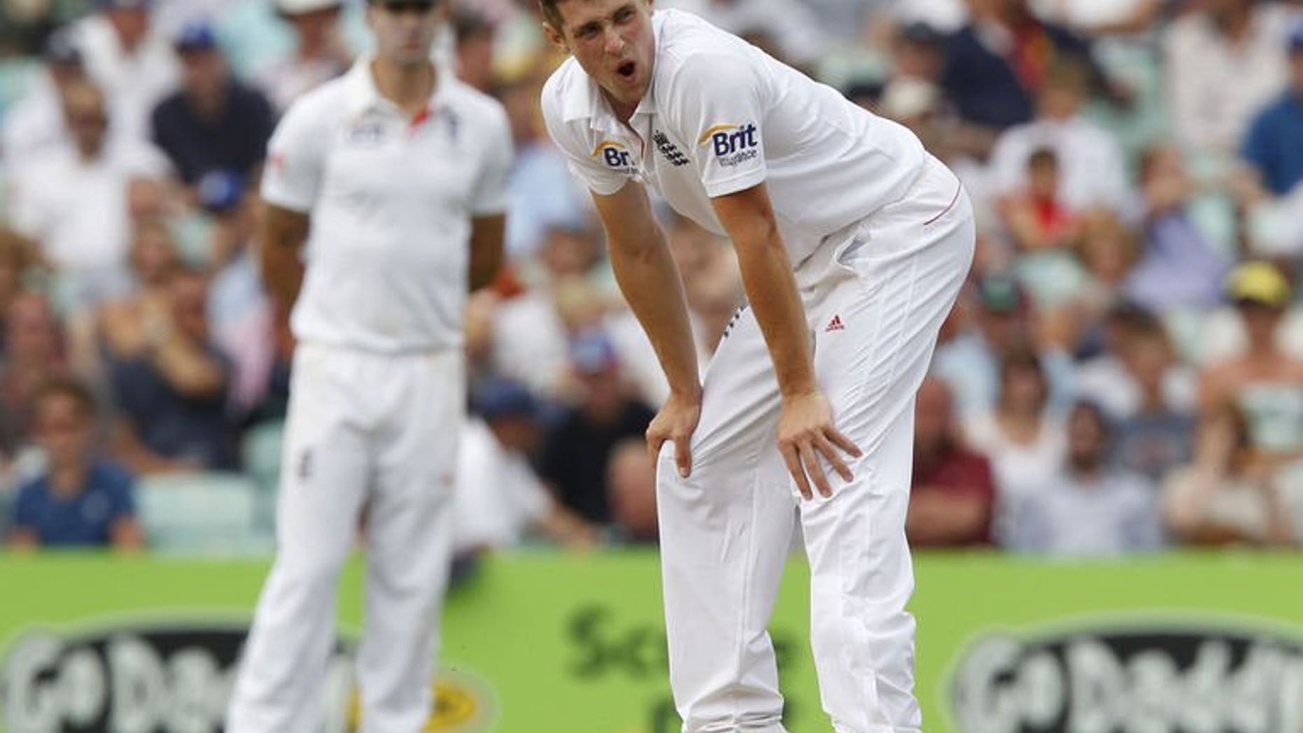 England's Chris Woakes reacts during play on the first day of the fifth Ashes cricket test match between England and Australia at The Oval cricket ground in London on August 21, 2013.