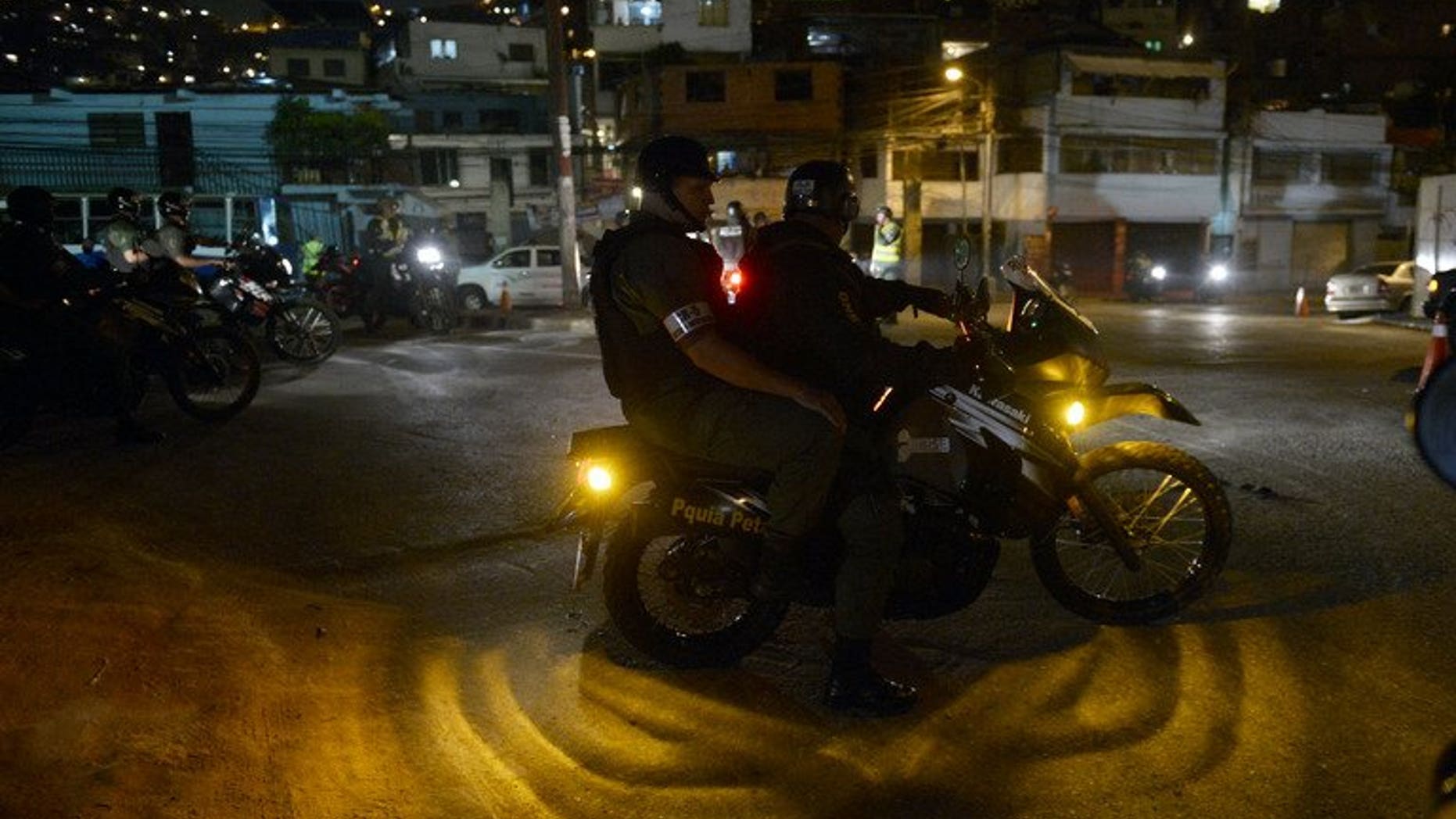 Members of the National Guard carry out a security operation in the impoverished Petare neighbourhood, one of Caracas' most dangerous slums, on May 13, 2013. Venezuela is installing 30,000 surveillance cameras to crack down on rampant crime, officials said Wednesday.