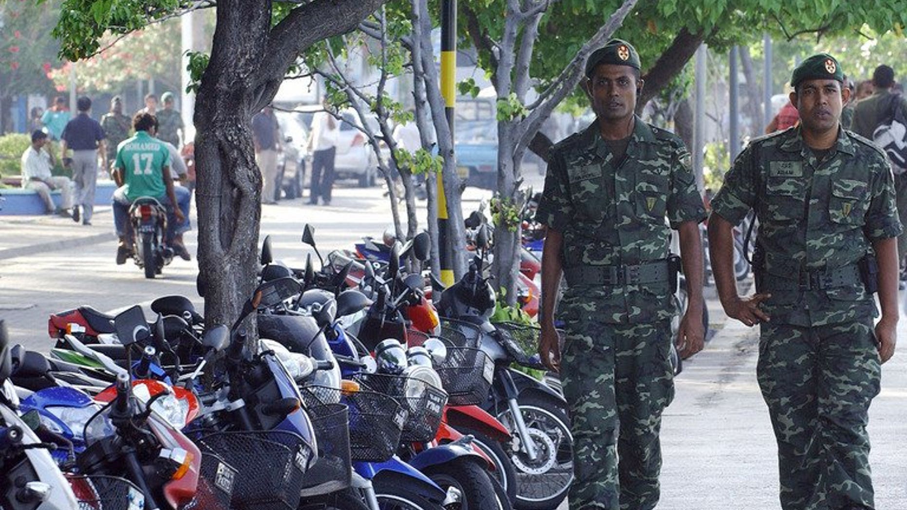 File photo of Maldivian security personel on patrol in Male. The Maldivian High Court has overturned a public flogging sentence for a 15-year-old rape victim whose conviction sparked outrage among rights groups and focused attention on the island nation treatment of women.
