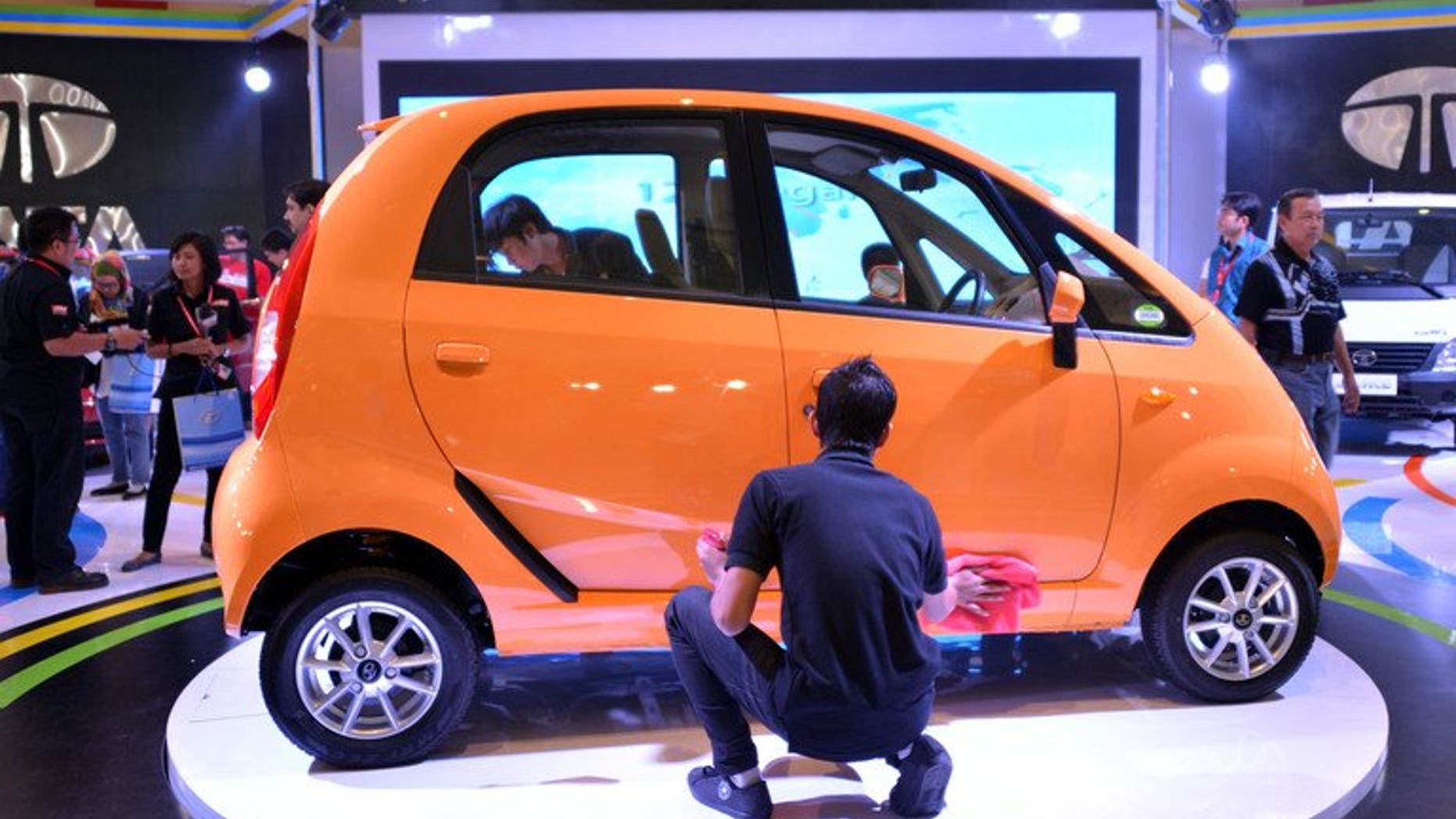 A Nano car manufactured by Tata of India is displayed at the Indonesia International Motor Show 2012 in Jakarta. India's top vehicle maker Tata Motors says it plans to reposition the Nano as a "smart city car" after its marketing pitch as the world's cheapest auto resulted in disappointing sales.