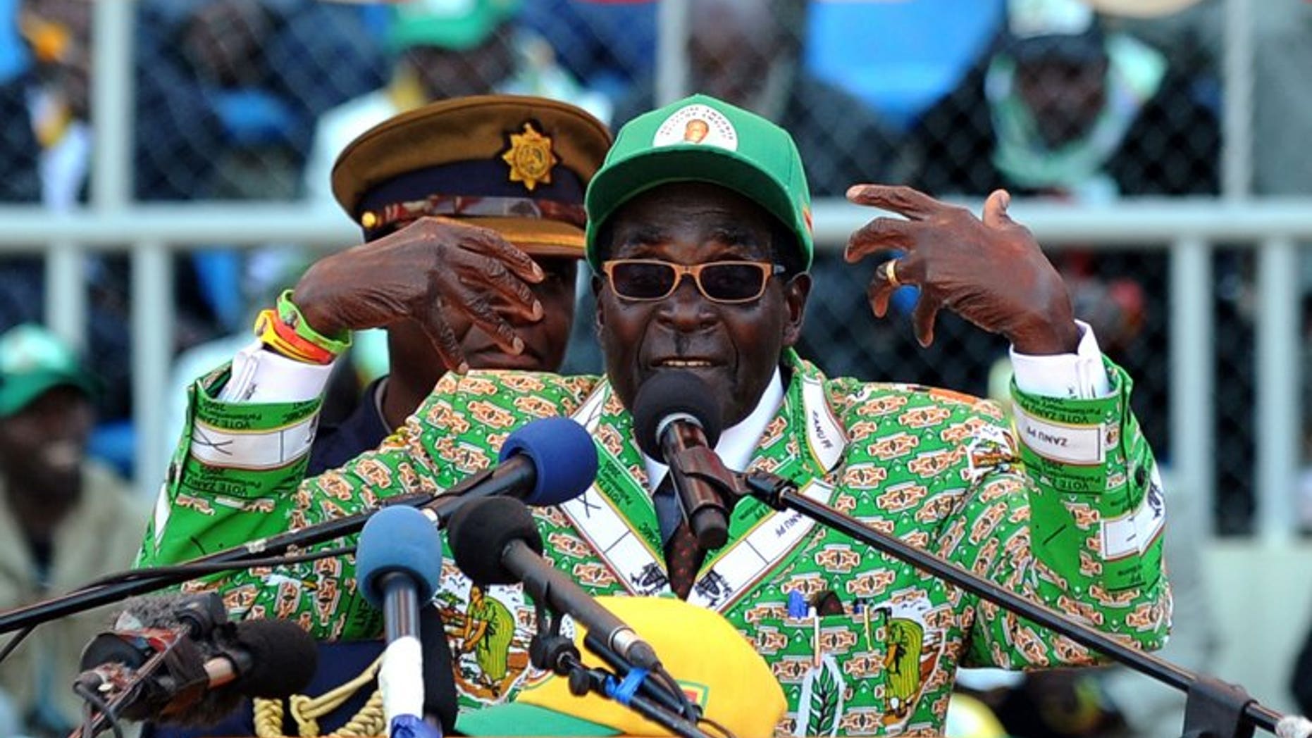 Zimbabwe's President Robert Mugabe addresses at a rally in Harare on July 28, 2013. Veteran leader Robert Mugabe was sworn in as Zimbabwe's president for another five-year term before a stadium packed with thousands of jubilant supporters Thursday. Mugabe, 89, pledged "to observe, uphold and defend the constitution of Zimbabwe" in an oath administered by Chief Justice Godfrey Chidyausiku.