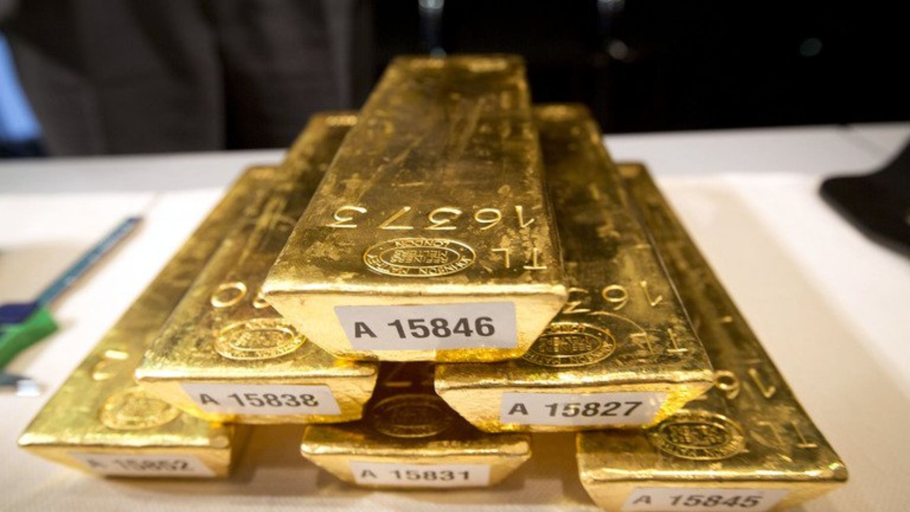 Bars of gold at a press conference at the German Federal Bank in Frankfurt, Germany, on January 16. The world's biggest gold producer, the Canadian firm Barrick Gold, is to sell three mines in Australia to South African competitor Gold Fields for $300 million, the companies said.