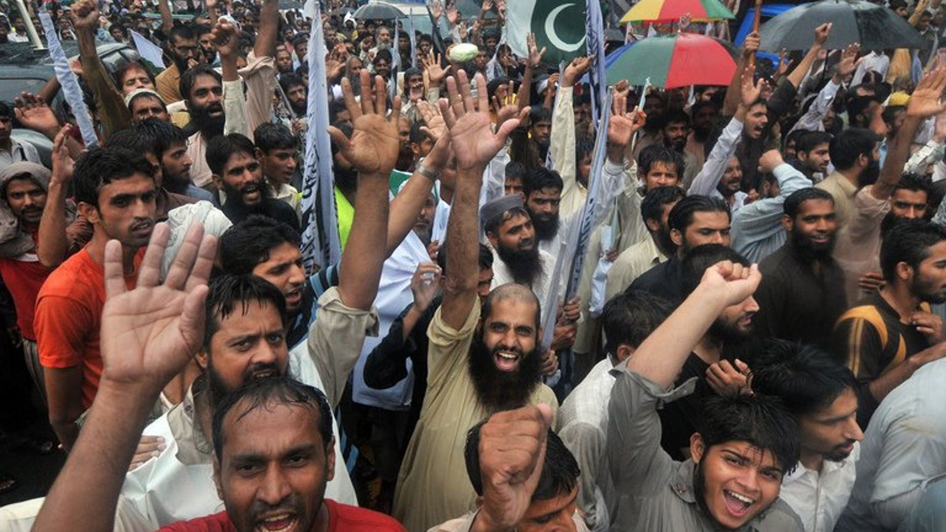 Supporters of Pakistan's outlawed Islamic hardline group Jamaat ud Dawa shout slogans during an anti-Indian protest rally in Lahore on August 14, 2013. Pakistan accused Indian troops Thursday of killing a soldier in disputed Kashmir, the latest in a series of reported clashes which have raised tensions between the nuclear-armed neighbours.