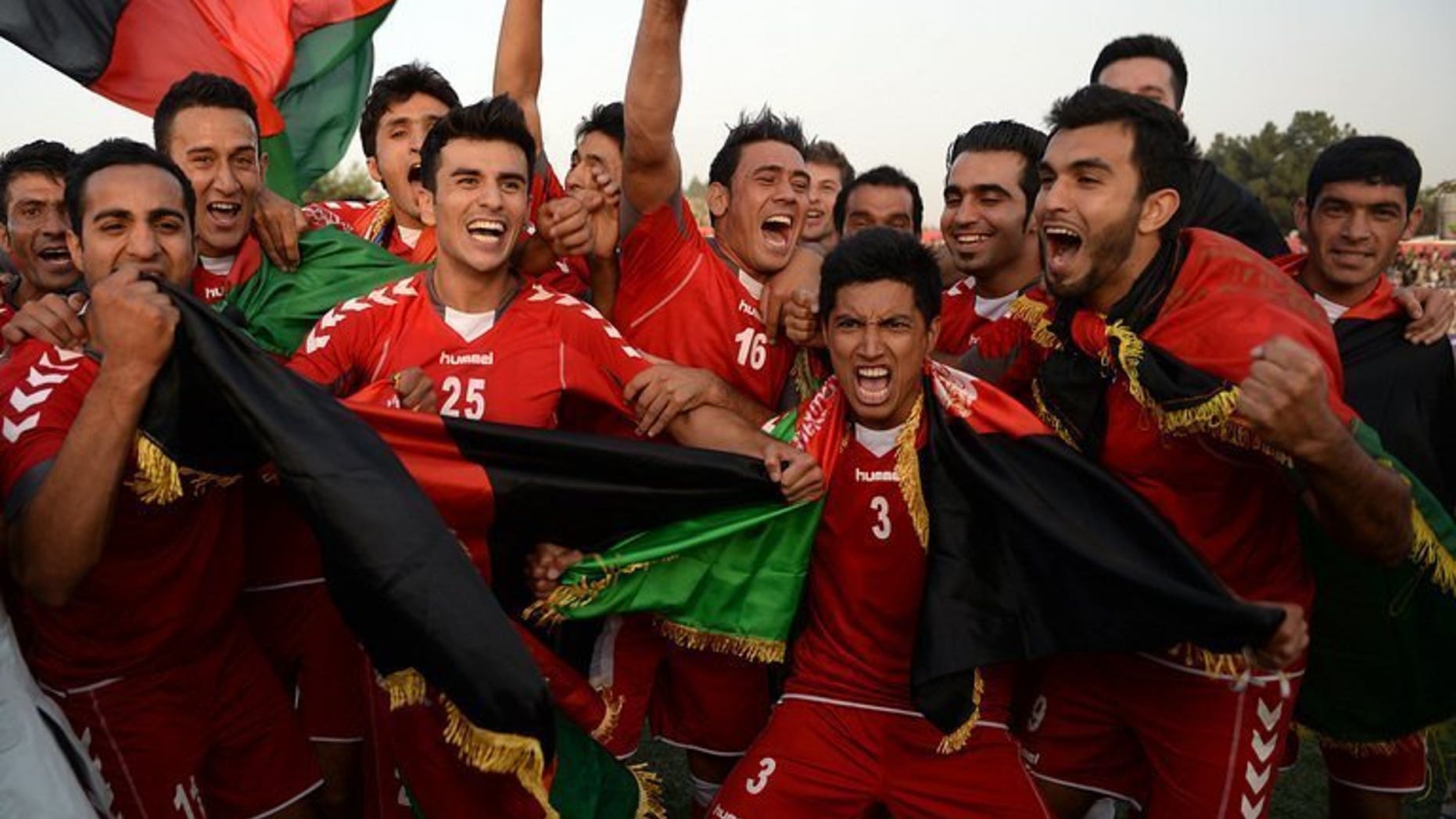 Afghan players celebrate their 3-0 win against Pakistan in Kabul on Tuesday. Pakistan Thursday appointed Bahrain's Mohammed Shamlan as their new coach to change the dwindling fortunes of their national team which lost to neighbouring Afghanistan in a historic match this week.
