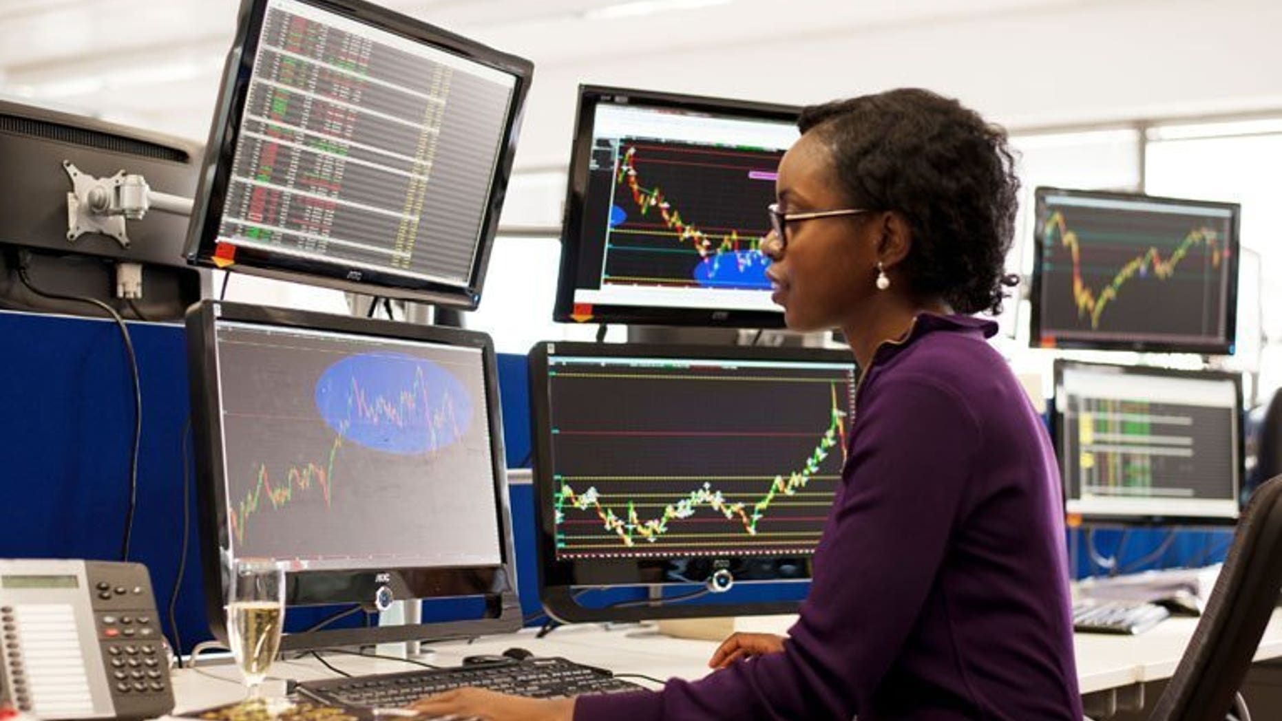 A woman takes part in a trader training programme in London on September 19, 2011. London shares recovered on Thursday as IMI surged after the engineering company's first half results.