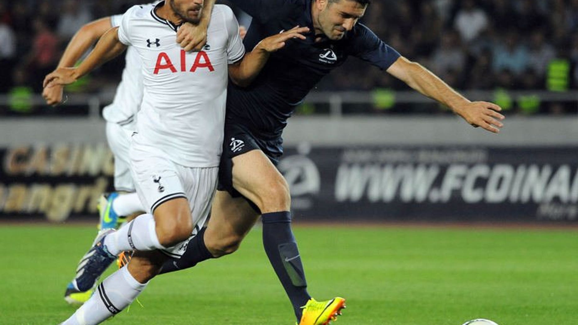 FC Dinamo Tbilisi's Givi Kvaratskhelia (R) vies with Tottenham Hotspur FC's Roberto Soldado during the UEFA Europa League qualifying football match between FC Dinamo Tbilisi and Tottenham Hotspur FC in Tbilisi on August 22, 2013. Tottenham won 5-0.