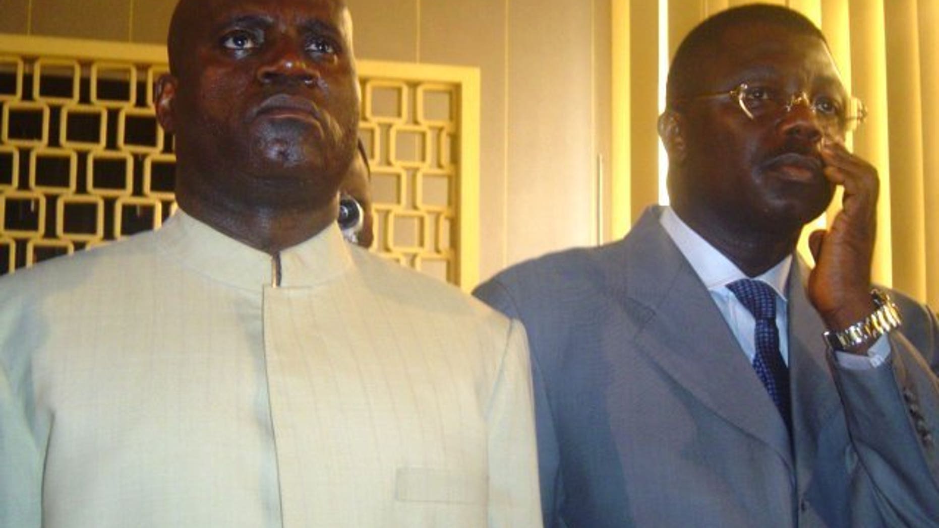 Norbert Dabira (L) listens to the verdict of a case on August 17, 2005 in Brazzaville. The Congolese general, wanted in connection with the 1999 disappearance of 350 refugees, was arrested in France on Thursday and charged with crimes against humanity, a court source said.