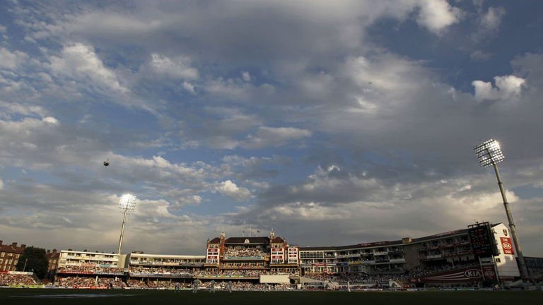 A general view of the ground, with floodlights on in the early evening sunshine during play on the second day of the fifth Ashes cricket test match between England and Australia at The Oval cricket ground in London on August 22, 2013.