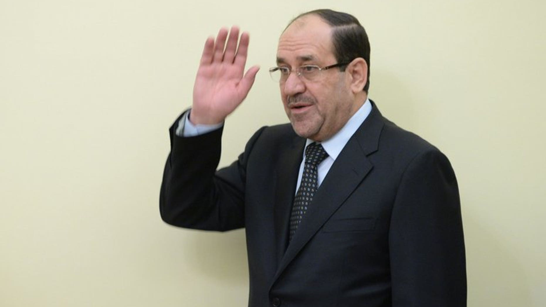 Iraqi Prime Minister Nouri al-Maliki waves as he arrives for an agreement signing with Indian Prime Minister Manmohan Singh in New Delhi on August 23, 2013. Iraq's prime minister on Friday pitched for investment from India to rebuild his war-shattered nation, which is a critical energy supplier to New Delhi.