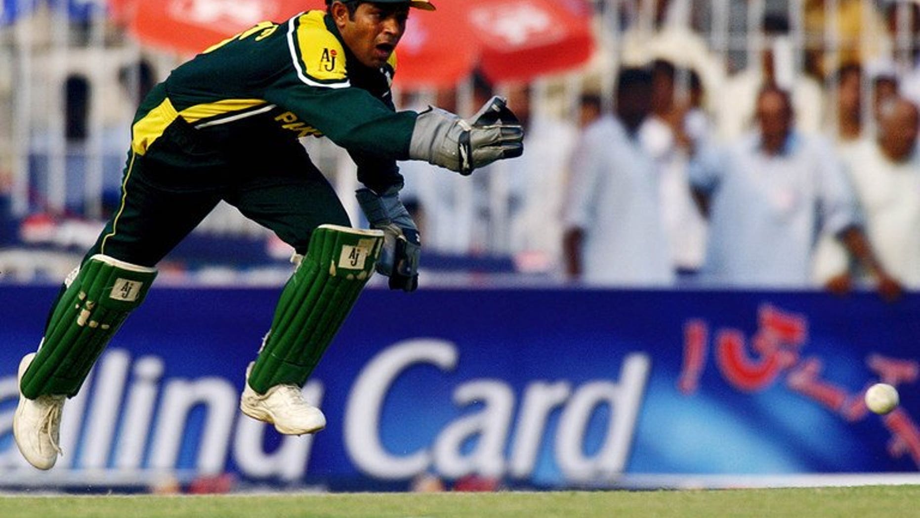 Pakistani wicketkeeper Rashid Latif leaps in an attempt to field a ball in Faisalabad, on October 7, 2003. The Pakistan Cricket Board said Friday that former captain Latif must apologise or provide proof supporting his claims that an alleged bookie was their guest in 2005.