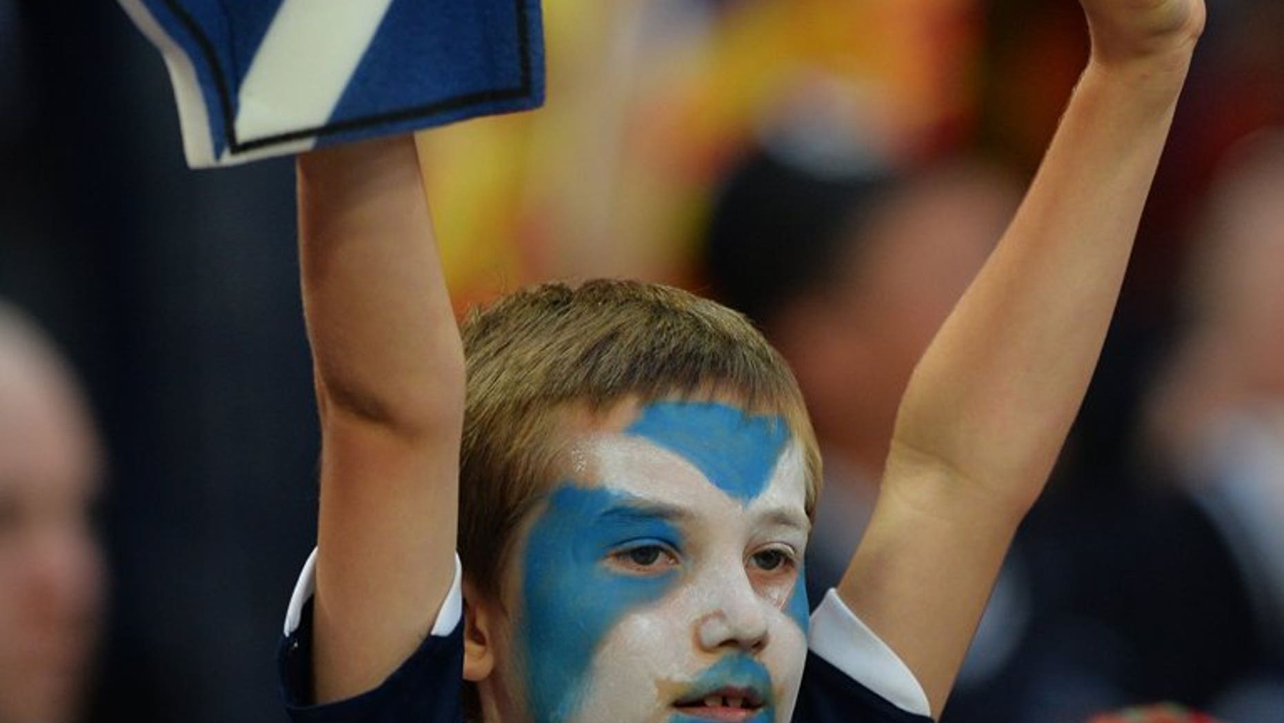 A young Scottish fan waits for kick off at Wembley Stadium in London on August 14, 2013. Watford's Ikechi Anya on Friday received his first Scotland call-up after being named in the squad for the World Cup qualifiers against Belgium and Macedonia next month.