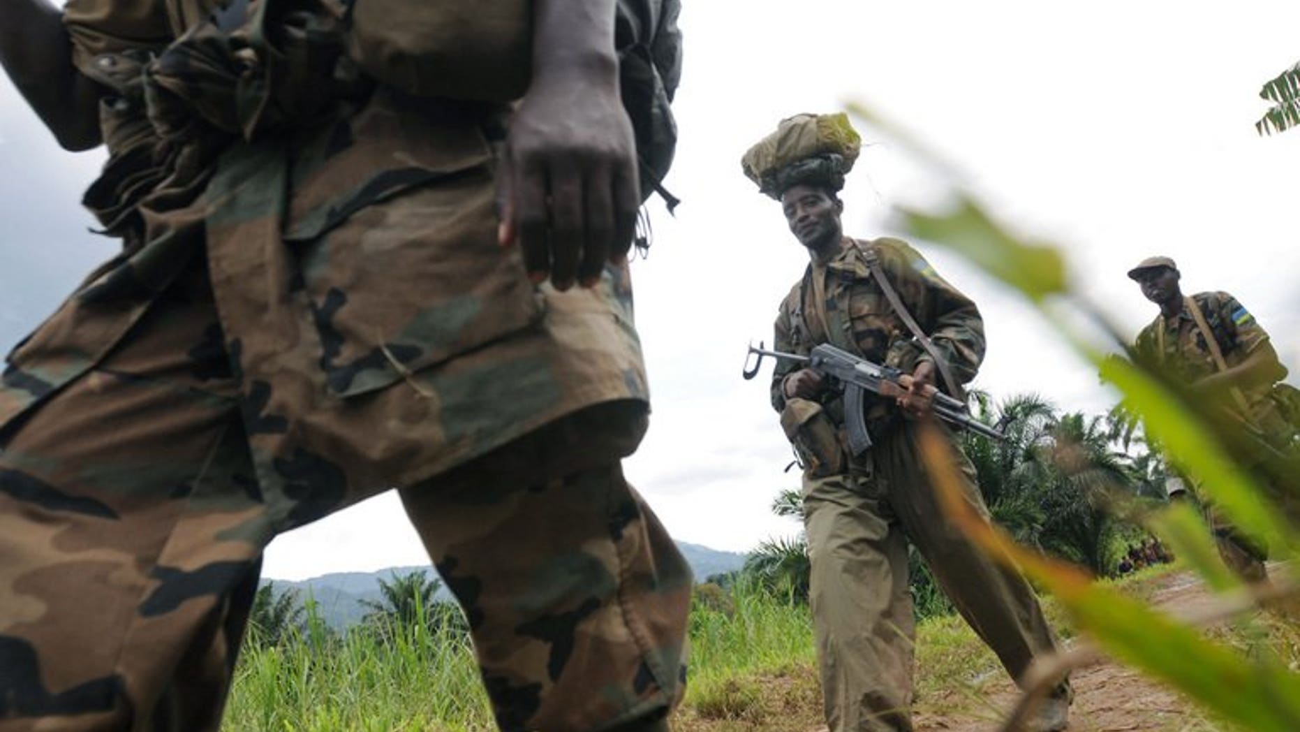 Rwandan Defence Force soliders on February 05, 2009 in Pinga, 150kms north west of Goma. Rwanda's army has warned neighbouring Democratic Republic of Congo, who it accuses of deliberate bombing over the border, that it will not stand by "indefinitely", in a statement late Friday.