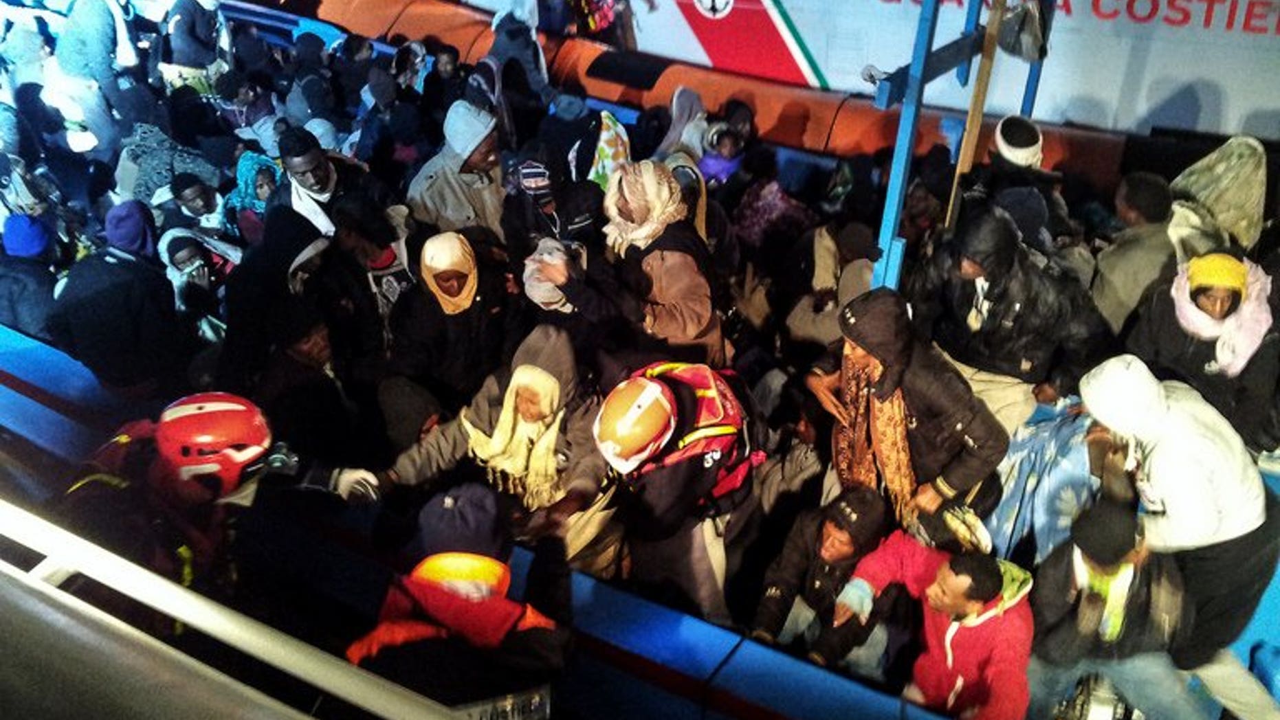 A handout photo provided on December 15, 2012 by the Italian Coast Guard press office shows a boat carrying 218 sub-Saharan migrants near the island of Lampedusa on December 14. The Italian coast guard said Saturday it had rescued more than 200 migrants off Sicily, swelling the ranks of the thousands of boat people who have made the crossing thanks to calm summer waters.