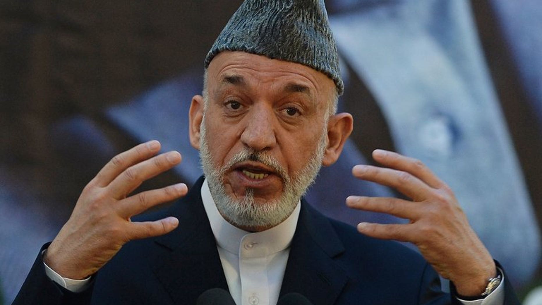 Afghan President Hamid Karzai speaks at a military academy outside Kabul on June 18, 2013. Karzai said Saturday that the United States should ensure a better future for villages where an American army sergeant went on a killing rampage last year.