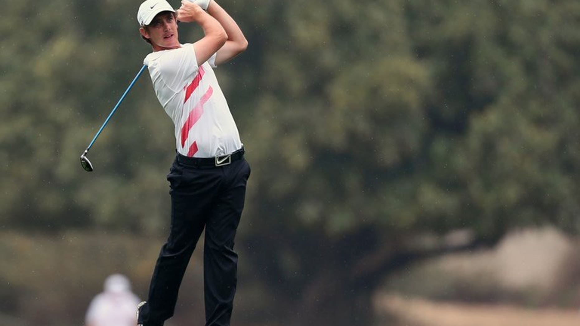 Tommy Fleetwood of Britain tees off during the third round of the Dubai Desert Classic golf tournament in Dubai on February 2, 2013. Fleetwood earned a share of the lead with Argentina's Ricardo Gonzalez after the third round of the Johnnie Walker Championship at Gleneagles on Saturday.