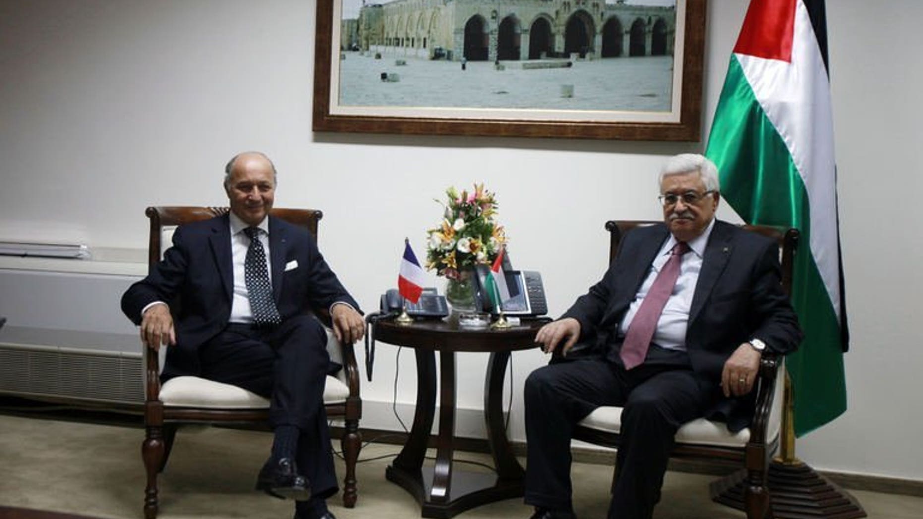 French Foreign Minister Laurent Fabius meets with Palestinian President Mahmud Abbas (R) on August 24, 2013 in the West Bank city of Ramallah. A successful outcome to the US-brokered negotiations between Israel and the Palestinians would be like a "thunderbolt" for peace in the crisis-ridden Middle East, French Foreign Minister Laurent Fabius said Saturday.