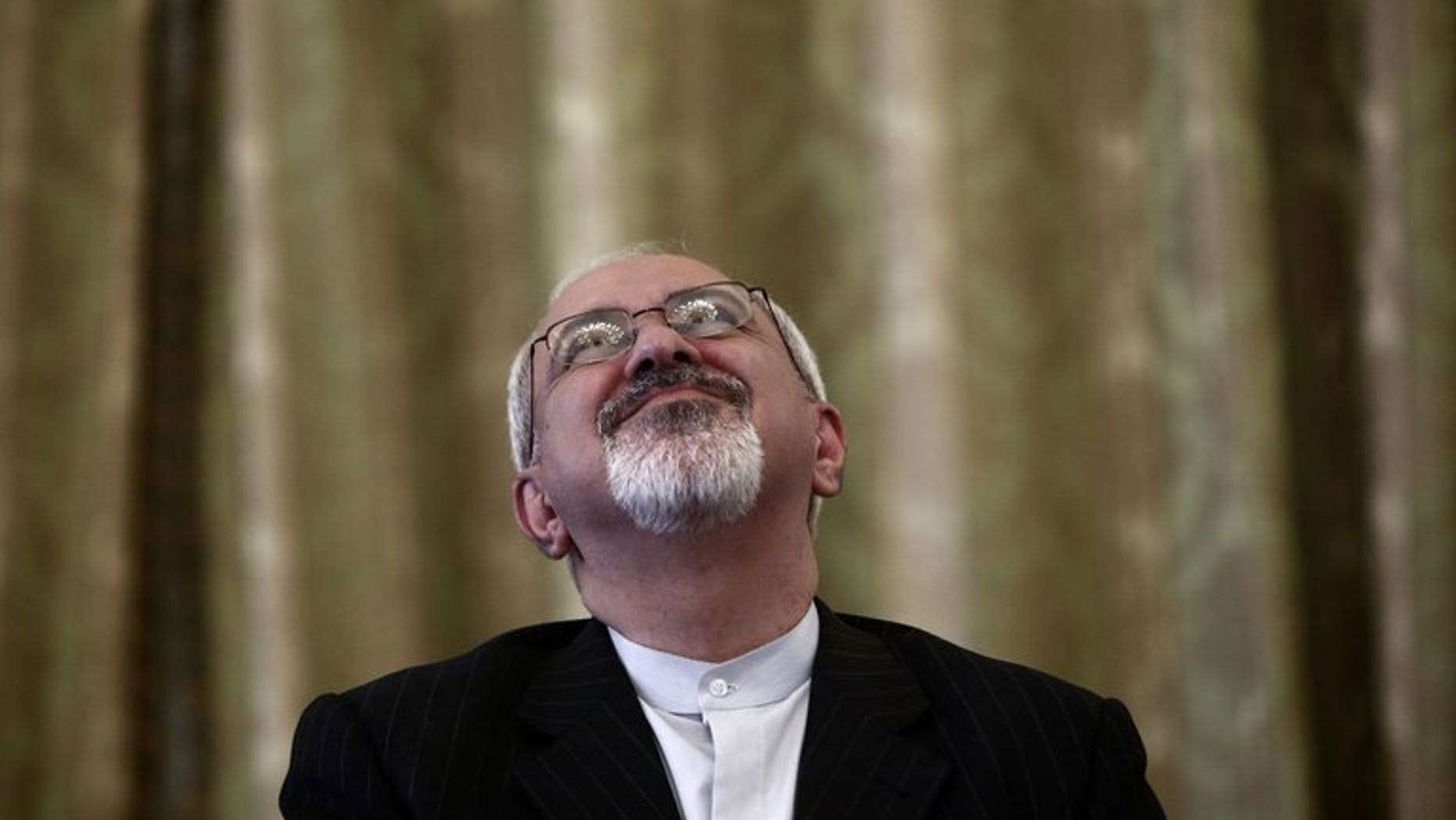 Iranian Foreign Minister Mohammad Javad Zarif attends a ceremony in Tehran on September 1, 2013. Zarif said on Facebook that Tehran condemns the World War II Nazi massacre of the Jews, in stark contract to Holocaust denials by former president Mahmoud Ahmadinejad.