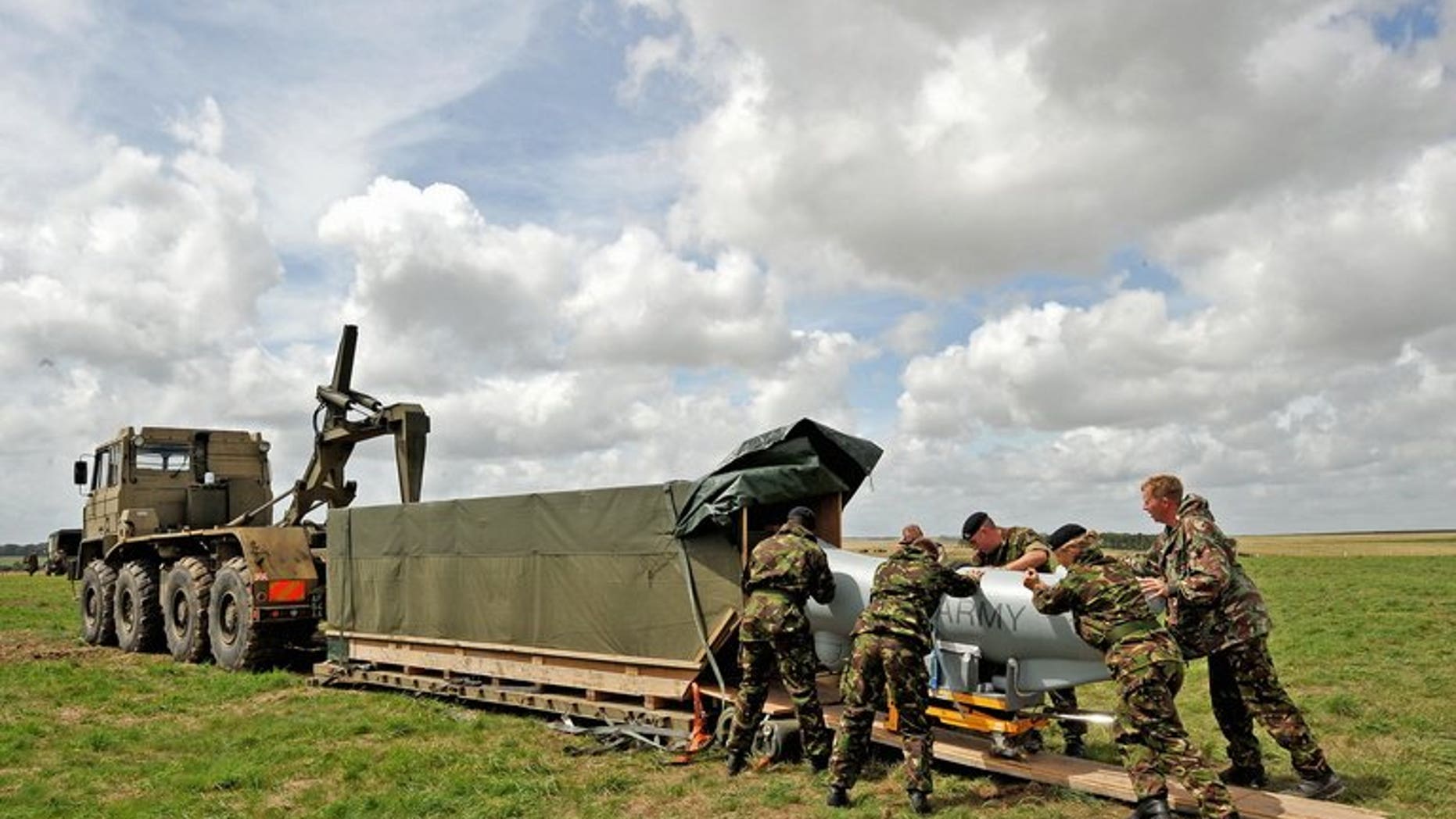 British soldiers load an unmanned aerial vehicle at Westdown Camp near Salisbury on July 22, 2009.