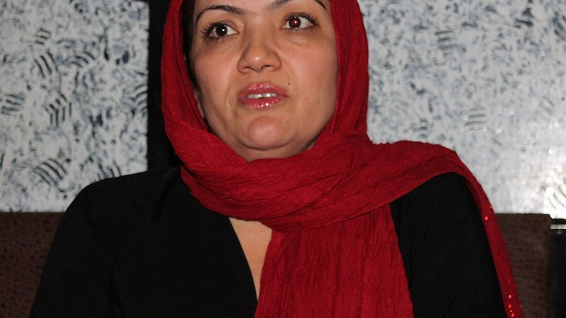 This photograph taken on June 9, 2013 shows Afghan lawmaker Fariba Ahmadi Kakar speaking during an interview with AFP in Kandahar. The Taliban claims that Kakar -- an Afghan female MP held hostage by the militant group since August 10 -- has been freed in exchange for six prisoners who were relatives of their fighters.