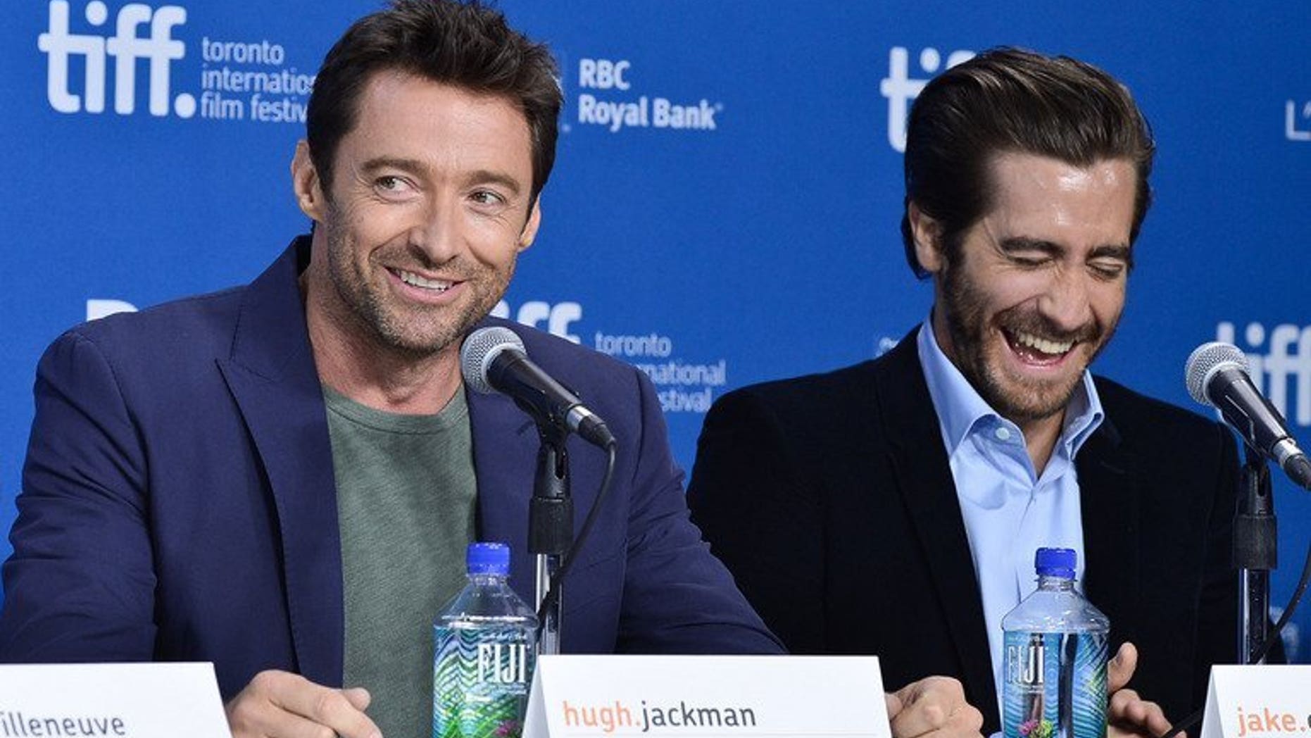 Actors Hugh Jackman (L) and Jake Gyllenhaal speak onstage at the "Prisoners" press conference during the 2013 Toronto International Film Festival on September 6, 2013 in Toronto, Canada. In Jackman's family, they stood on the couch and cheered for the accountants who tallied the Oscar ballots as they appeared on stage, he revealed Saturday.