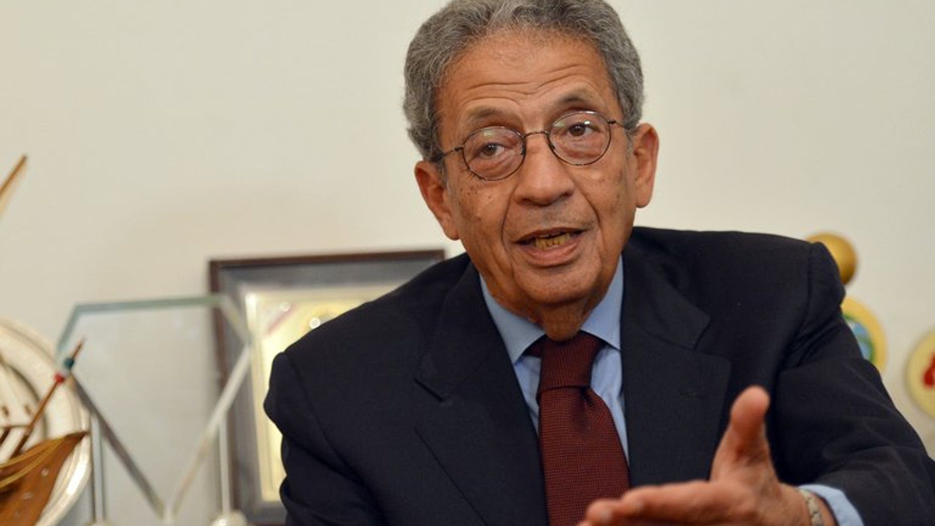 Former Arab League chief Amr Mussa talks during an interview with AFP at his office in Cairo, on March 14, 2013. Mussa has been elected head of Egypt's 50-member panel that has been tasked with drawing up a new constitution.