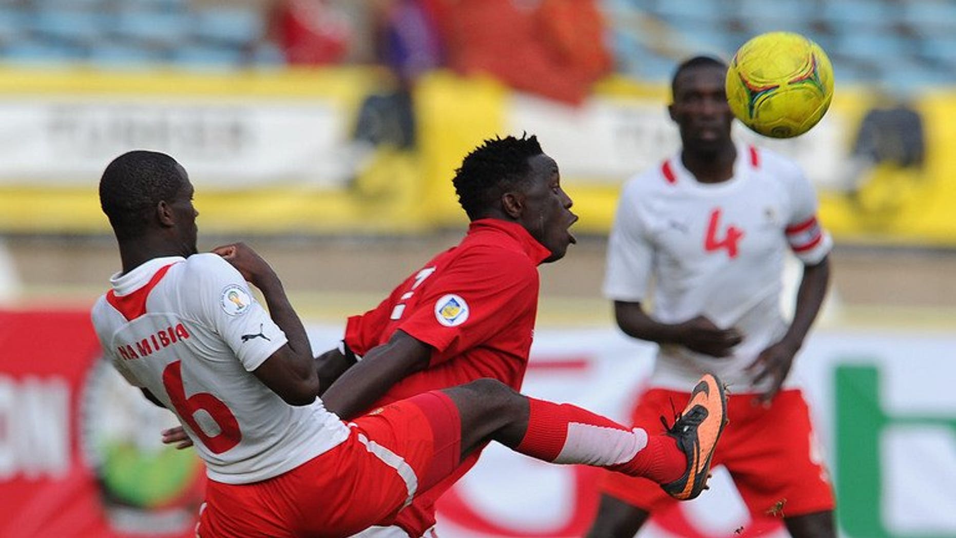 Kenya's Victor Wanyama (C) vies with Namibia's Horaeb Larry during the World Cup 2014 qualifying football match Kenya vs Namibia, on September 8, 2013 in Nairobi. Kenya won 1-0.