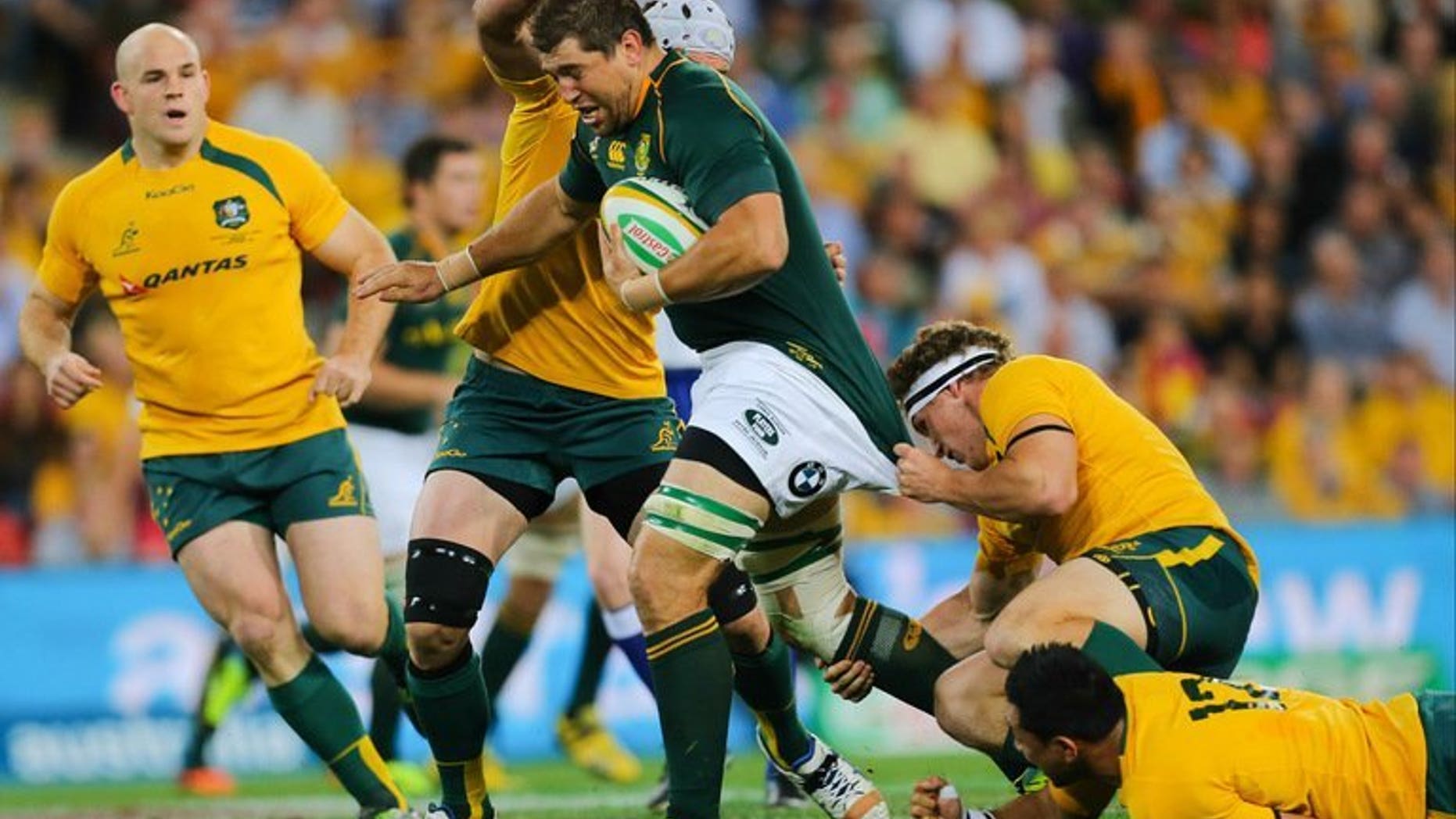 Australia's Michael Hooper and Christian Lealiifano try to tackle South Africia's Willem Alberts during their match on September 7, 2013. Lealiifano said Monday the team remain unified despite three straight losses under new coach Ewen McKenzie.