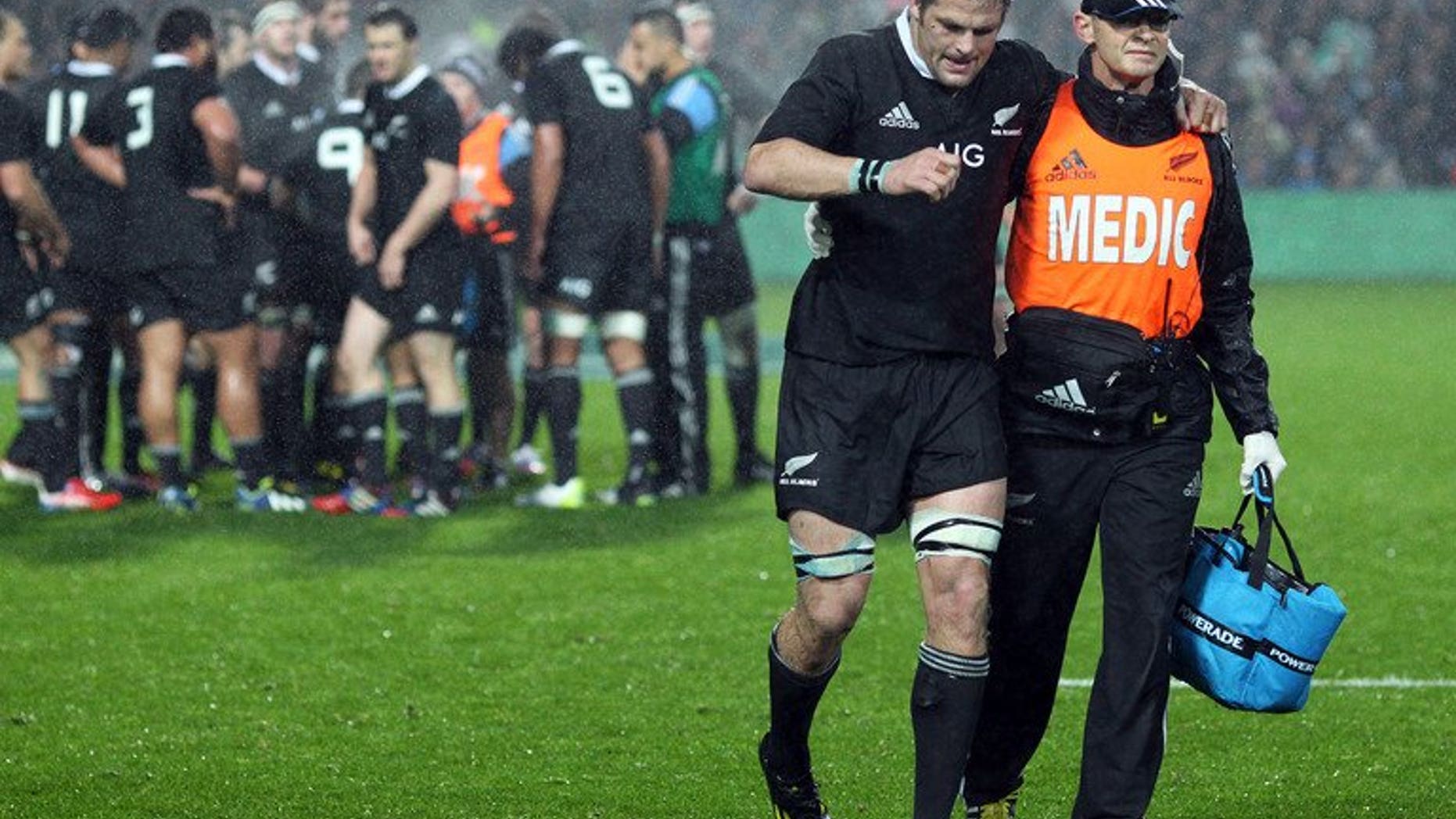 New Zealand's Richie McCaw is helped off the field during the Rugby Championship match against South Africa on September 7, 2013. The Springboks landed in Auckland Monday for "the ultimate challenge" against the All Blacks next weekend, claiming they remain the underdogs despite New Zealand losing McCaw.