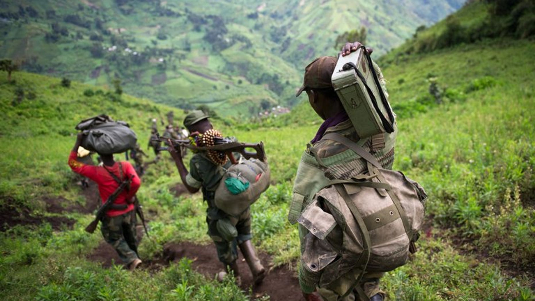 M23 rebels leave the village of Karuba, eastern DR Congo, on November 30, 2012. The rebeles say they are waiting for a government delegation to arrive to resume peace talks, in line with an ultimatum set by regional leaders.