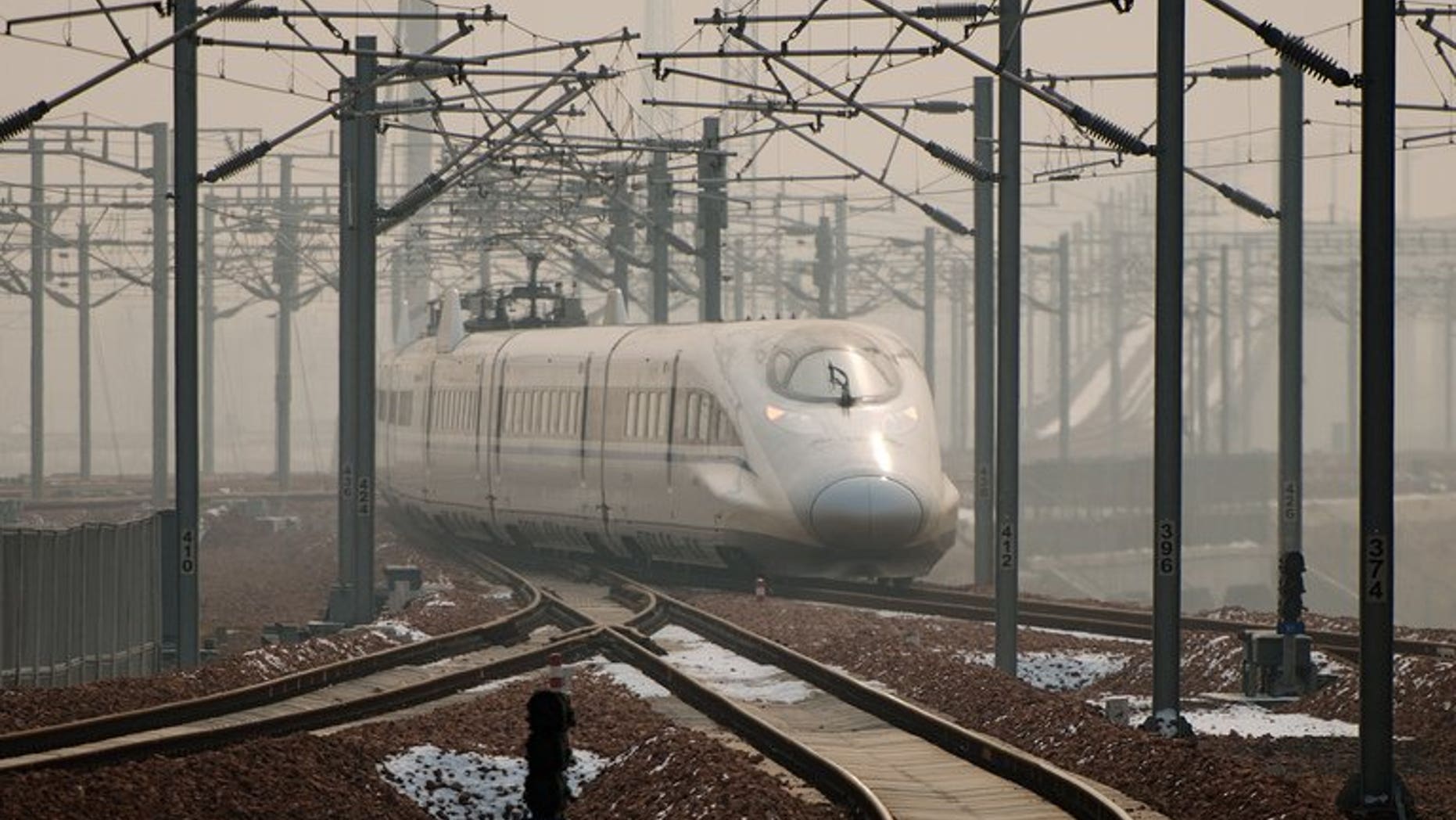 A high-speed train departs a platform in Hebei province south of Beijing on December 22, 2012. Senior official from teh country's disgraced railways ministry, Zhang Shuguang, went on trial Tuesday accused of bribery.